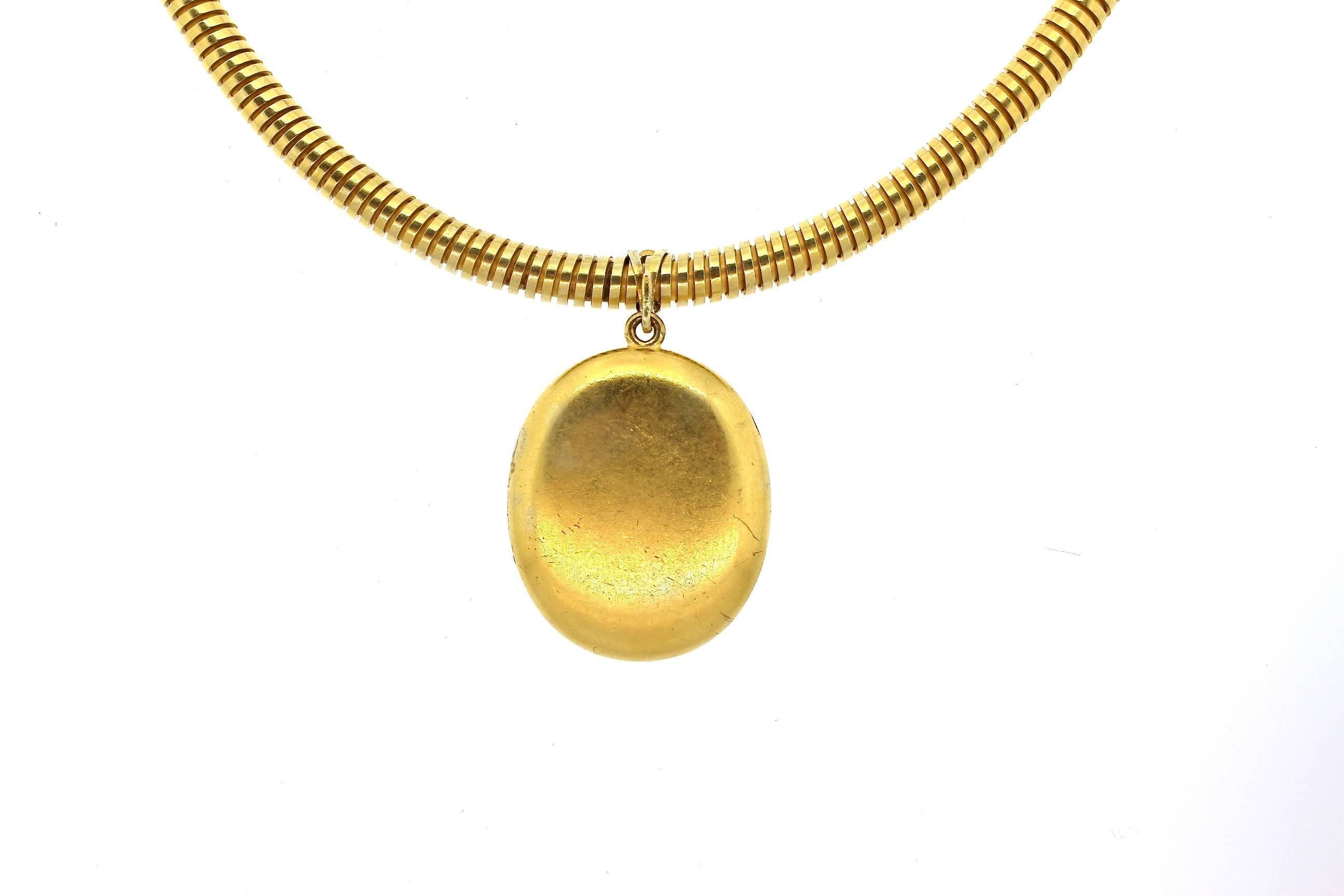 Original 14k gold gas pipe necklace suspending a locket with a ruby horseshoe made in Russia circa 1860.  The Russian maker is Leopold Karlovich who was a Russian Court jeweler in the 1850s and 1860s.  Though a little known maker, he indeed made
