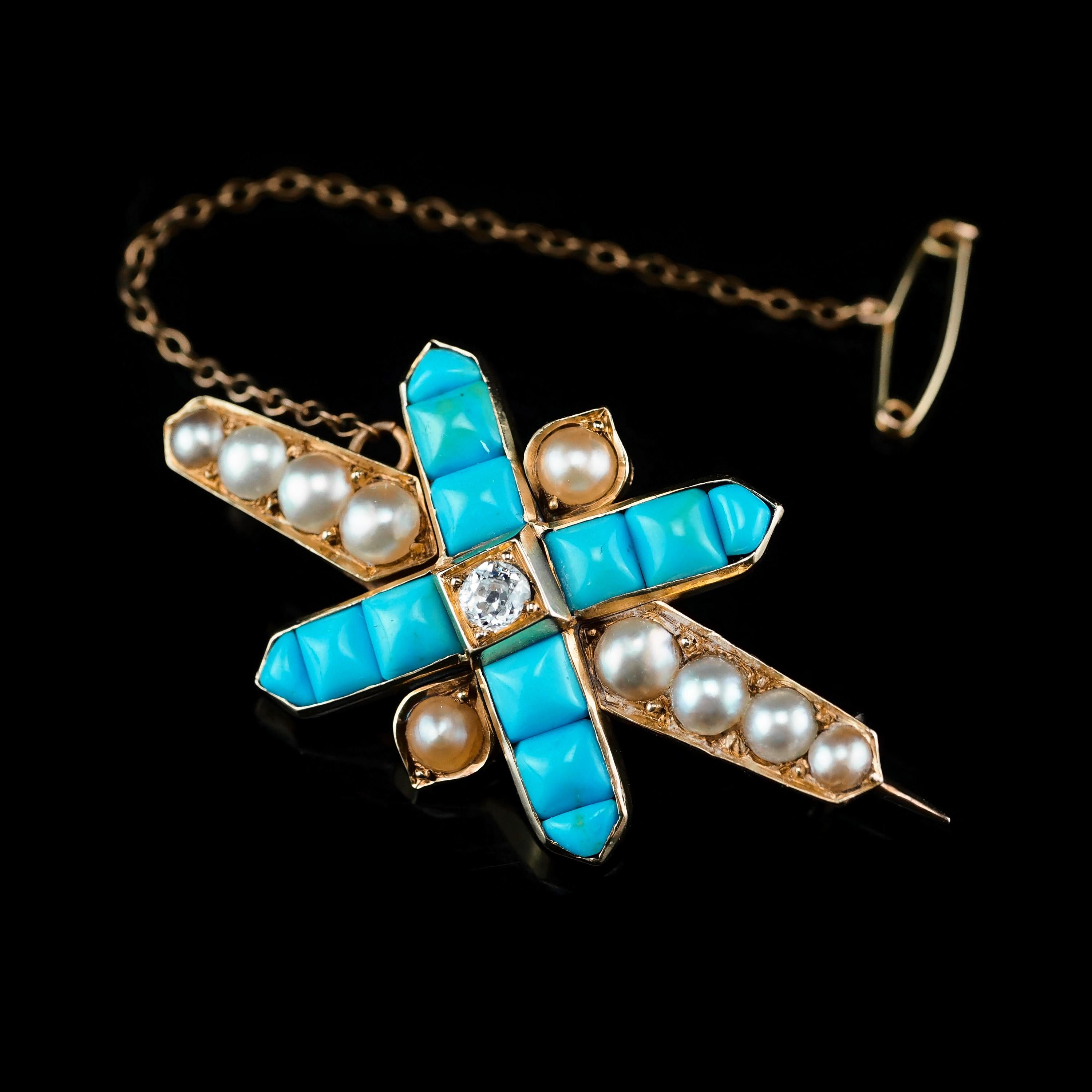 We are delighted to offer this stunning antique Victorian 14K gold brooch. 

This brooch presents an impressive and endearing design with a crossed centre portion with 12 turquoise stones and a sparkling central diamond. 

Adjacent to the cross, 10