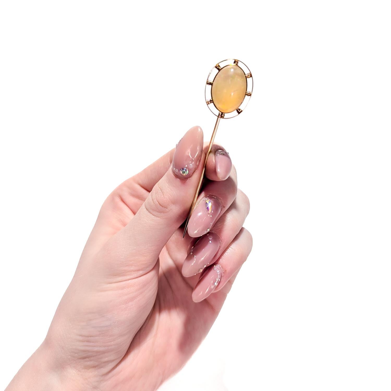 A fine vintage stickpin.

In 14 karat rose-toned gold.

Bezel-set with a milky, pink/orange agate cabochon and framed by a beaded oval frame. The stone has a slight iridescence.

Simply a wonderful stickpin!

Date:
20th Century

Overall