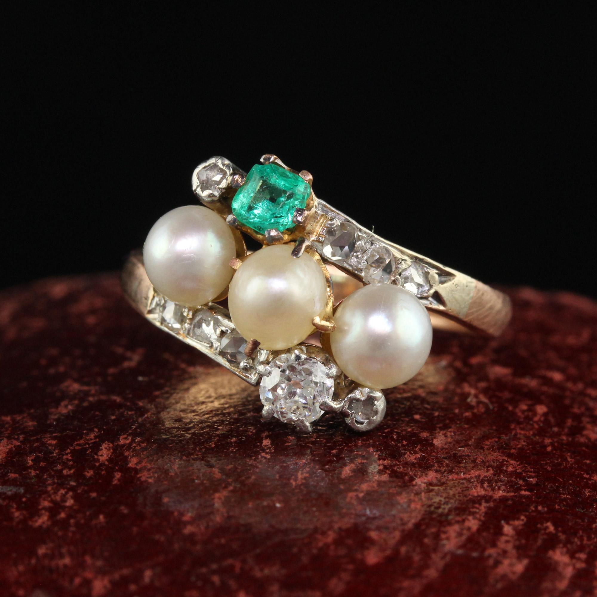 Beautiful Antique Victorian 14K Rose Gold Silver Old Mine Pearl Emerald Cocktail Ring. This gorgeous cocktail ring is crafted in 14k rose gold and silver top. The ring holds a row of beautiful pearls in the center with an old mine cut diamond and an