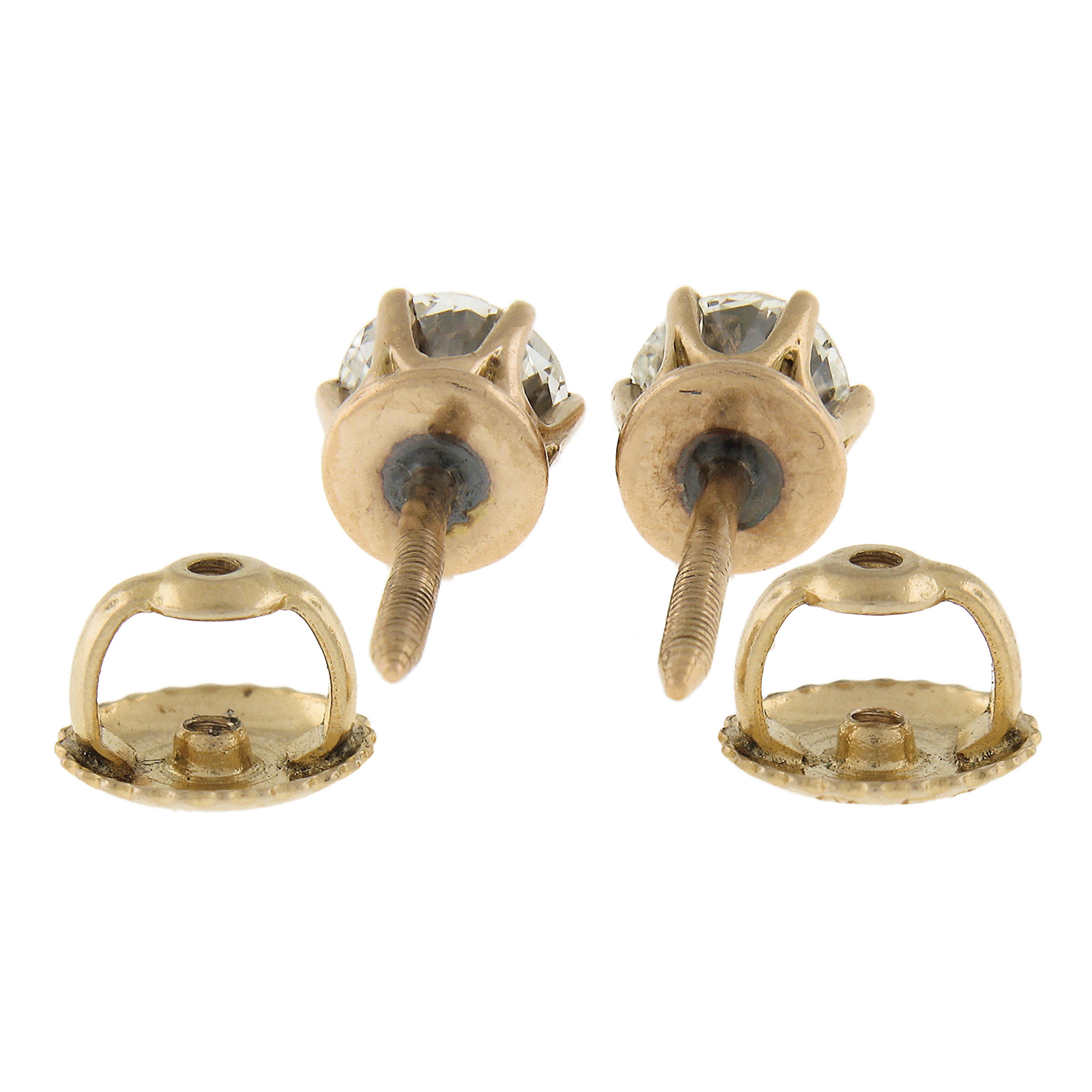 --Stone(s):--
(2) Natural Genuine Diamonds - Old Mine Cut - Multi Prong Set - I/J Color - VS2-SI1 Clarity
Total Carat Weight: 0.60 (approx.)

Material: Solid 14k Rosy Gold w/ Yellow Gold Backs
Weight: 1.22 Grams
Backing: Post Backs w/ Screw On