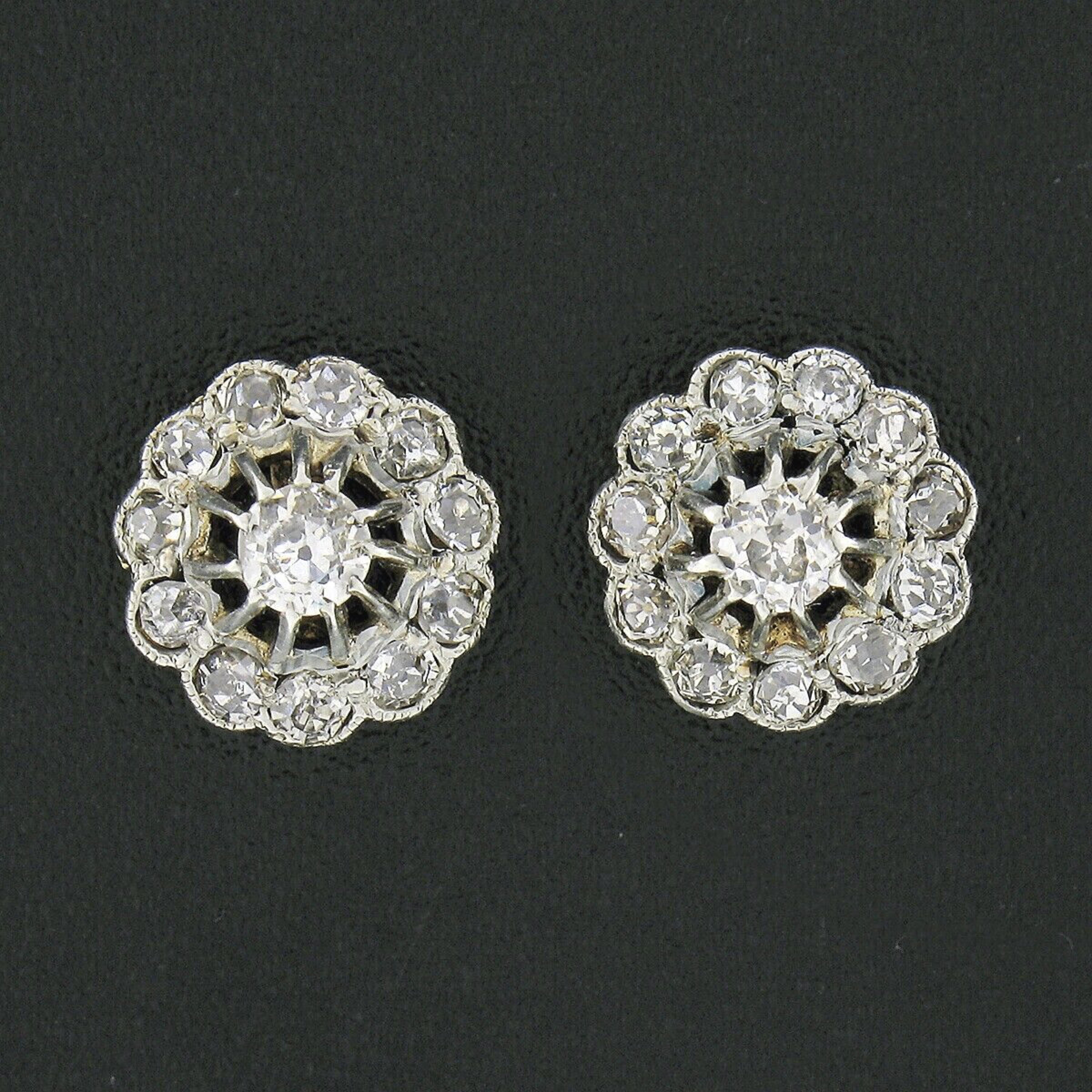 These gorgeous antique stud earrings were crafted during the early Victorian era from solid 14k yellow gold with a white gold top and silver posts. They feature a lovely flower cluster design set with old mine and single cut diamonds throughout. The