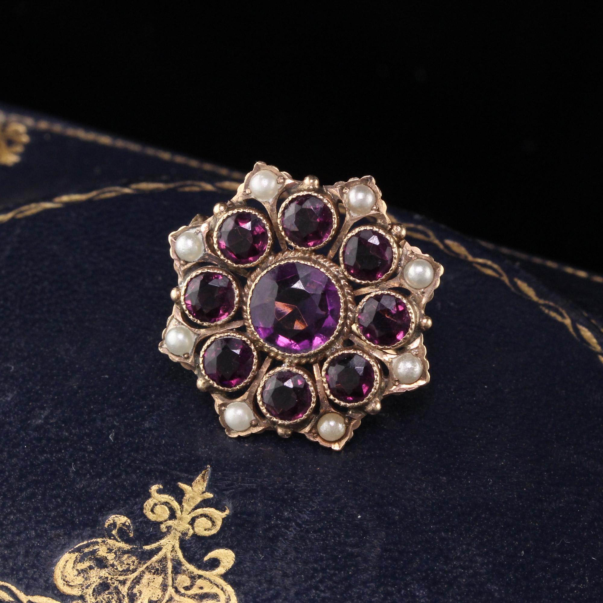 Antique Victorian brooch in a floral cluster design with amethysts and pearls. Engraved 'PAT 5-17-10'

Metal: 14K Yellow Gold 

Weight: 3.5 Grams 

Measurements: 23 mm diameter