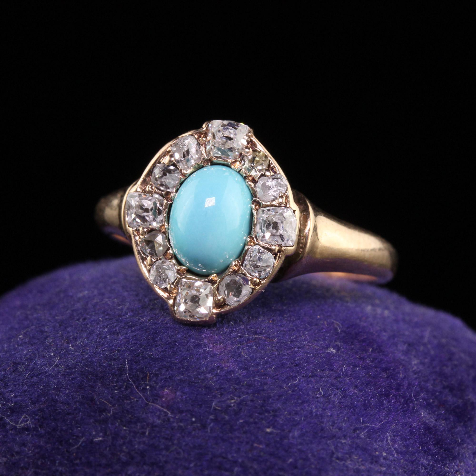 Beautiful Antique Victorian 14K Yellow Gold Cabochon Turquoise Old Mine Cut Diamond Ring. This gorgeous ring is crafted in 14k yellow gold. The center holds a cabochon turquoise and is surrounded by custom hand cut old mine diamonds and has a