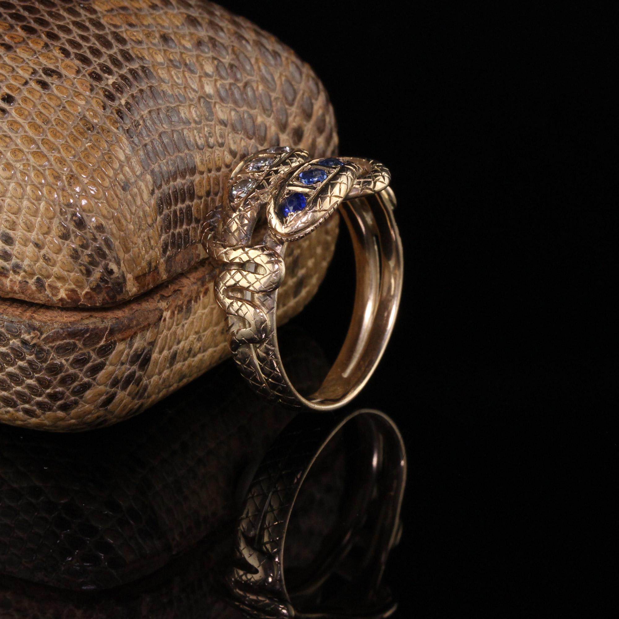 Gorgeous Antique Victorian 14K Yellow Gold Diamond and Sapphire Double Snake Ring. This amazing Victorian double snake ring has deep blue sapphire and white diamonds with two intertwining snakes. A very classic Victorian design! 

Item