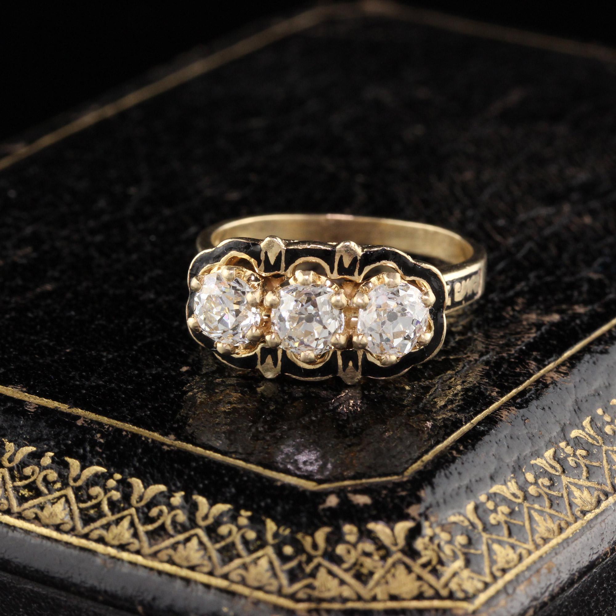 Beautiful & super unique Victorian 3 Stone Diamond Engagement ring in yellow gold with black enamel detailing. Enamel is in very good condition for its age. 

#R0399

Metal: 14K Yellow Gold 

Weight: 4.7 Grams

Diamond Weight: Approximately 1.35 cts