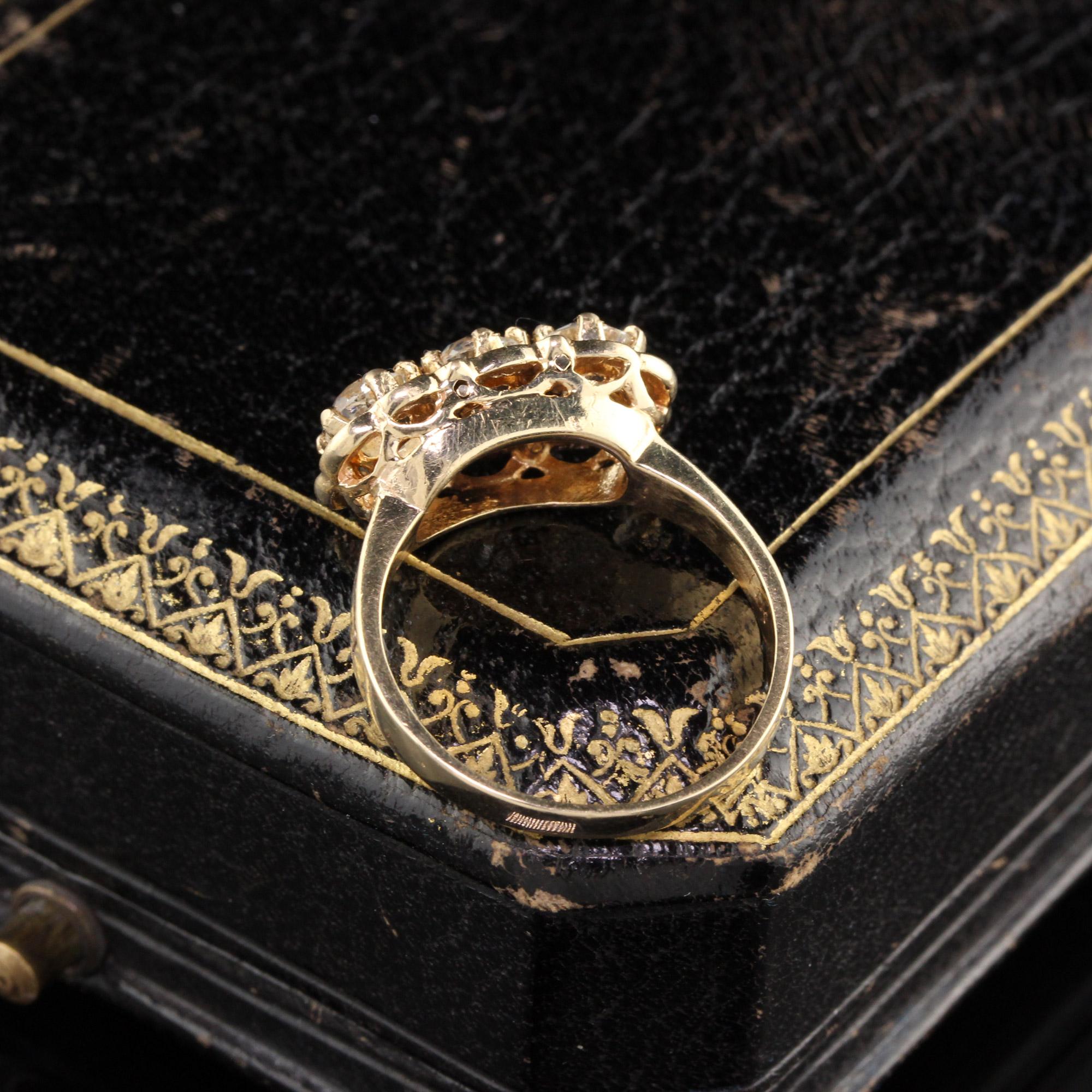 gold ring with black stones
