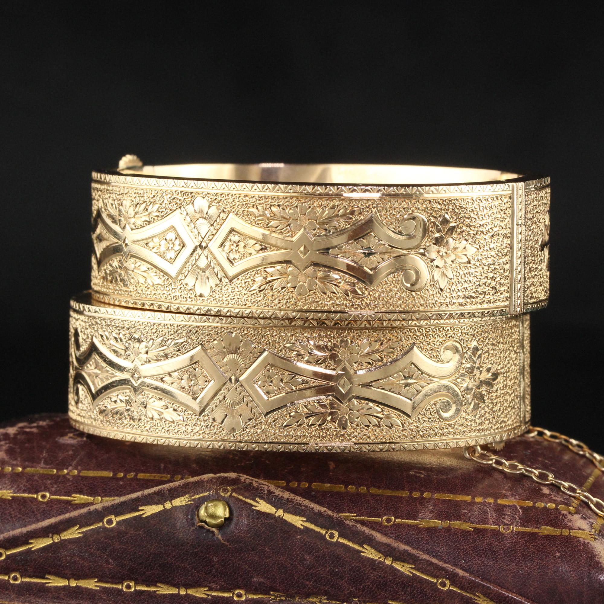 Beautiful Antique Victorian 14K Yellow Gold Engraved Wide Bangle Bracelet Set. This incredible pair of matching bangle bracelets are crafted in 14k. The bangles are beautifully engraved around the entire bracelet. There are some minor dents on the