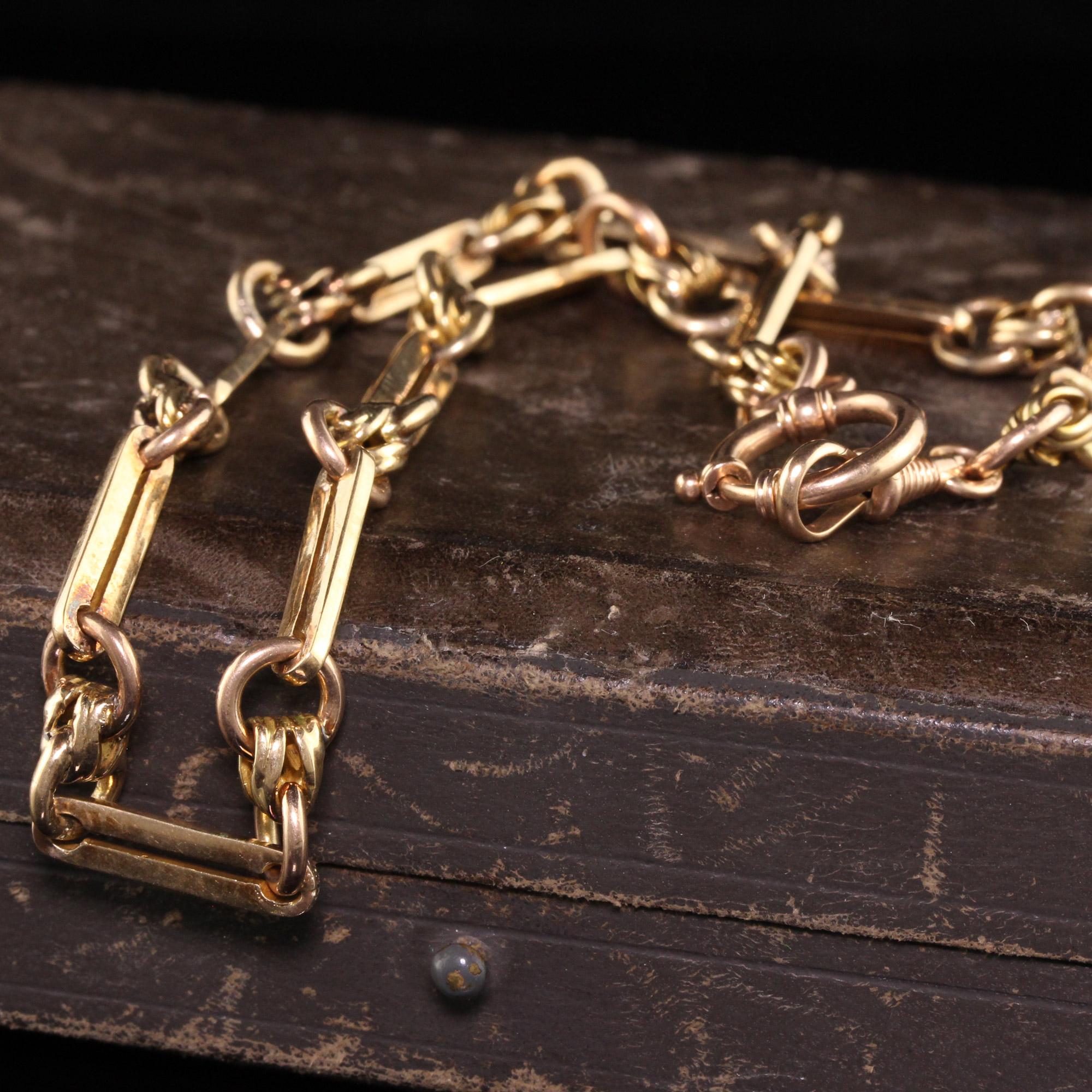 Beautiful Antique Victorian 14K Yellow Gold Intricate Necklace / Watch Fob - 14 Inches. This beautiful chain is crafted in 14K yellow gold. The chain has a nice design link going around the entire piece and is it in good condition.

Item
