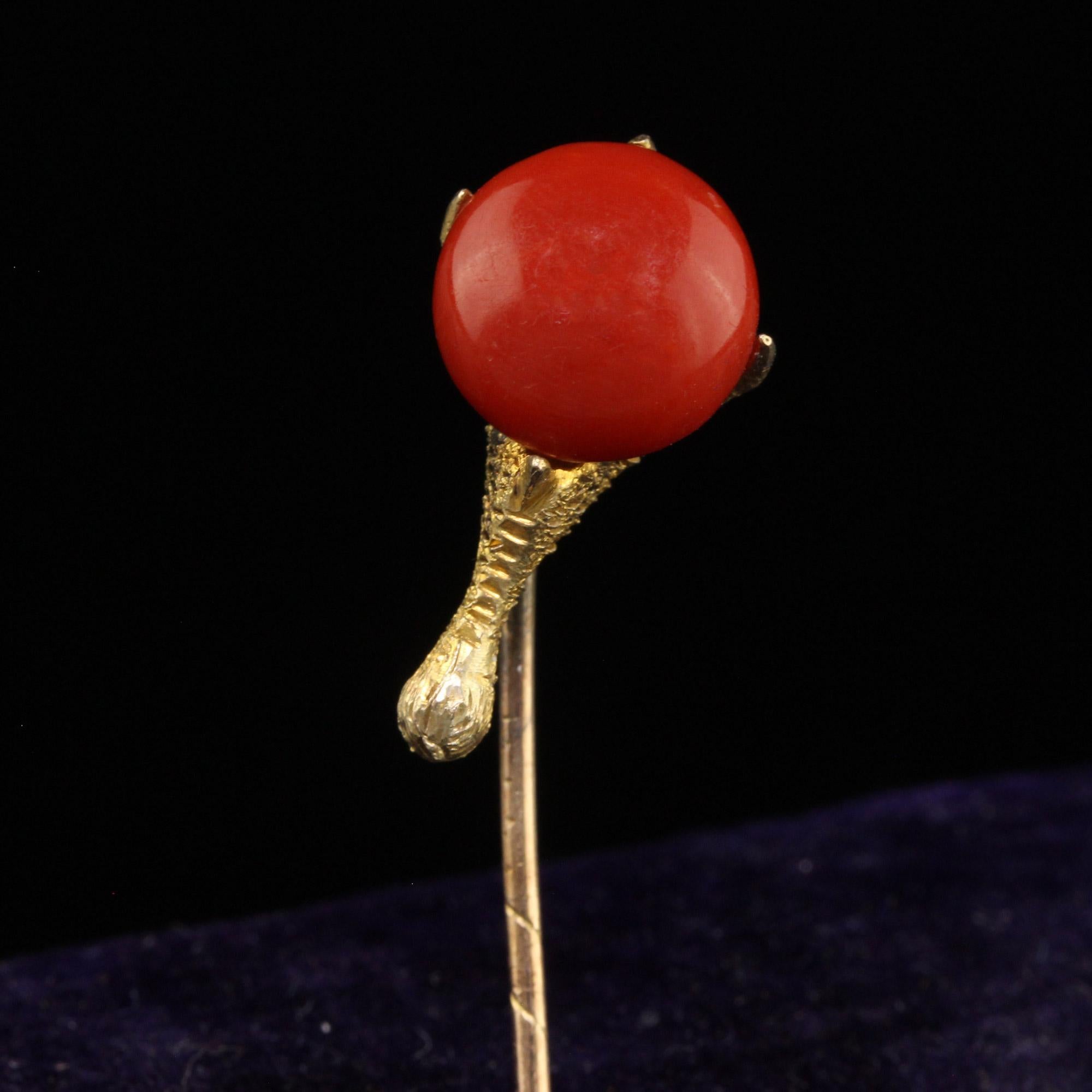 Beautiful Antique Victorian 14K Yellow Gold Natural Coral Claw Stick Pin. This gorgeous stick pin is crafted in 14k yellow gold. The center of this stick pin is a natural red coral that is being held by what looks like to be an eagles claw. The claw