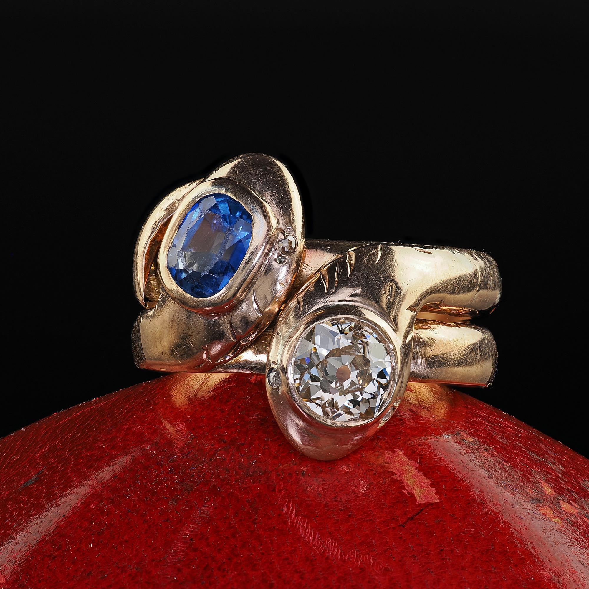 Beautiful Antique Victorian 14K Yellow Gold Old Cut Diamond and Sapphire Double Snake Ring. This gorgeous Victorian old cut diamond and sapphire double snake ring is crafted in 14k yellow gold. This ring features a natural blue sapphire and an old