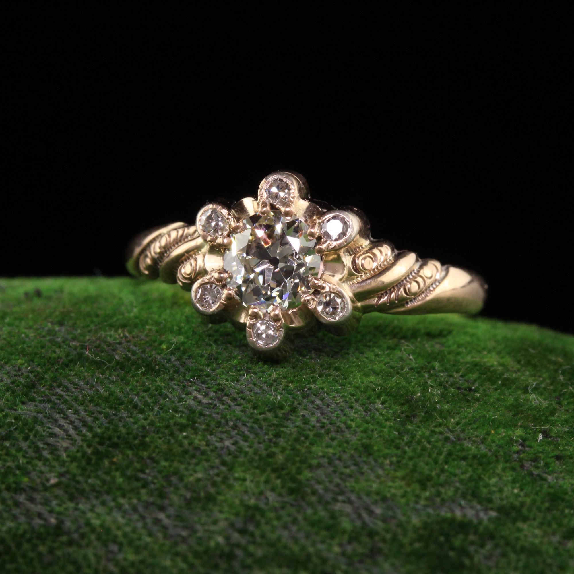 Beautiful Antique Victorian 14K Yellow Gold Old European Diamond Engagement Ring. This beautiful ring is crafted in 14k yellow gold. The ring holds a beautiful old european cut diamond in the center and is surrounded by old cut diamonds. The ring is