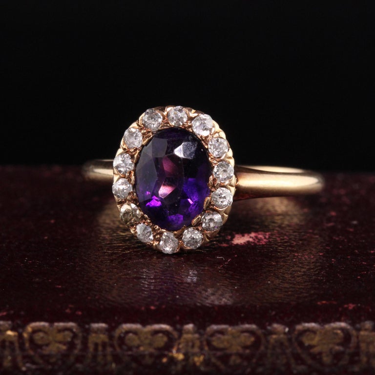 Beautiful Antique Victorian 14K Yellow Gold Old Mine Diamond Amethyst Engagement Ring. This beautiful ring features old mine cut diamonds surrounding a gorgeous amethyst center. The ring is crafted in 14k yellow gold and is in good condition.

Item