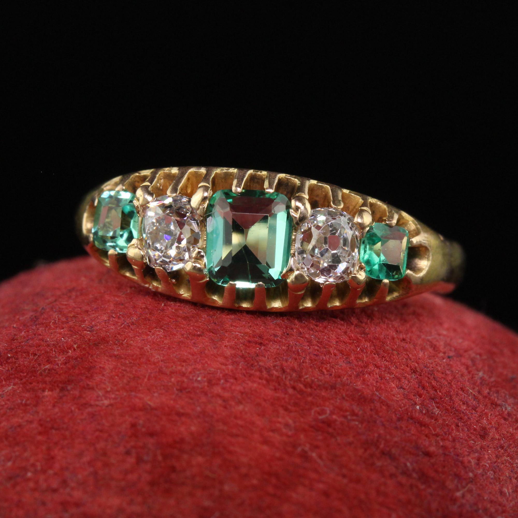 Beautiful Antique Victorian 14K Yellow Gold Old Mine Diamond and Emerald Five Stone Ring. This gorgeous Victorian old mine diamond and emerald ring is crafted in 14k yellow gold. The top of the ring features three chunky old cut emeralds and two old
