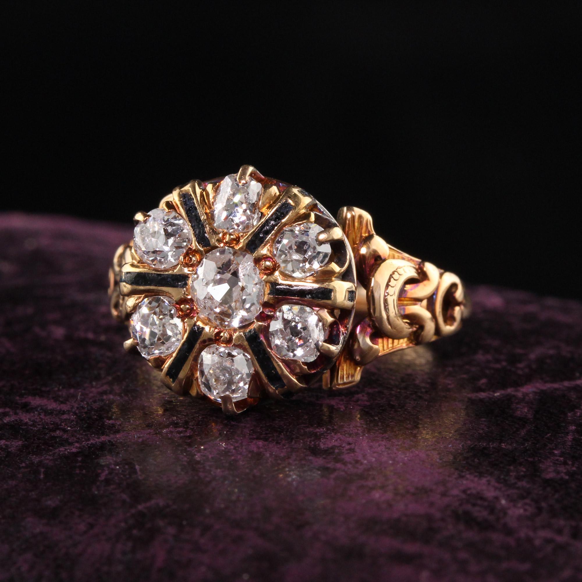 Beautiful Antique Victorian 14K Yellow Gold Old Mine Diamond and Enamel Ring. This gorgeous ring has 7 old mine cut diamonds set in a victorian mounting that has black enamel between each stone. The gold has a rosy patina to it and gives it so much