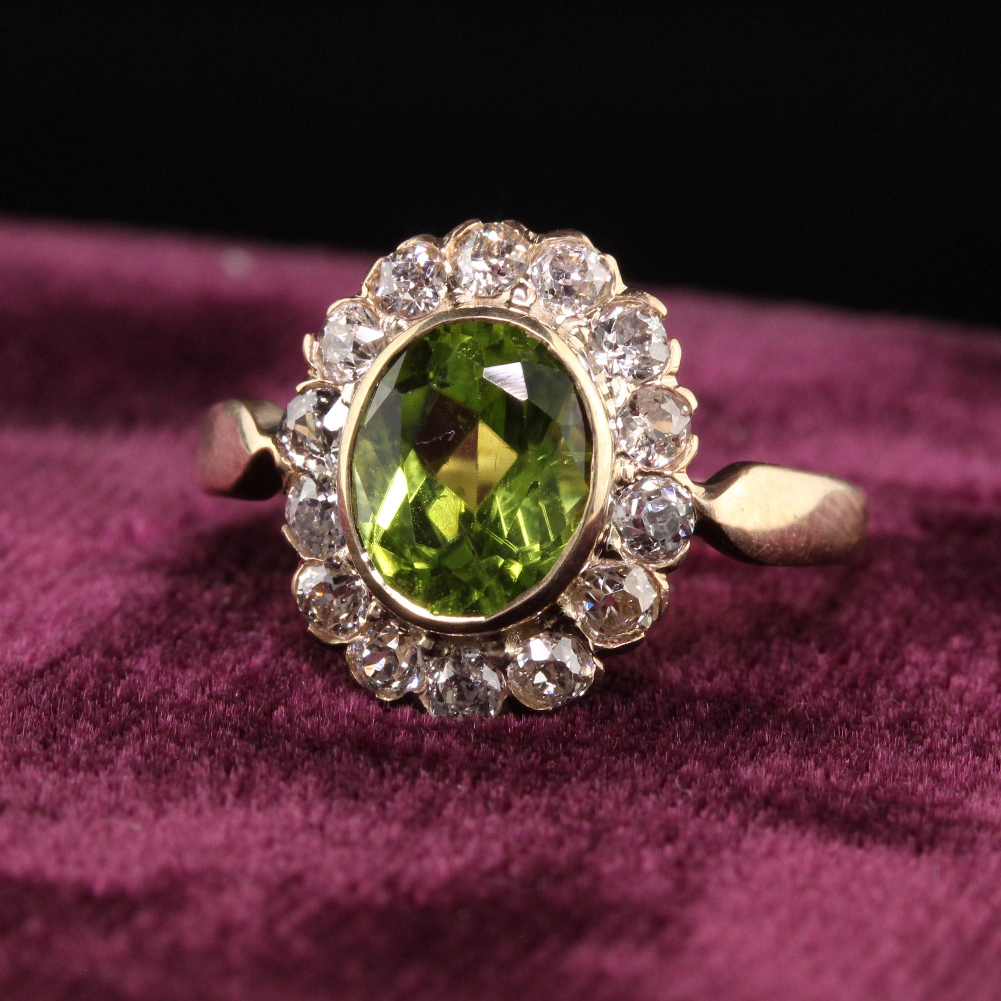 Beautiful Antique Victorian 14K Yellow Gold Old Mine Diamond and Peridot Ring. This gorgeous Victorian peridot ring has old mine cut diamonds surrounding a center peridot with a beautiful green color. It sits low on the finger and very