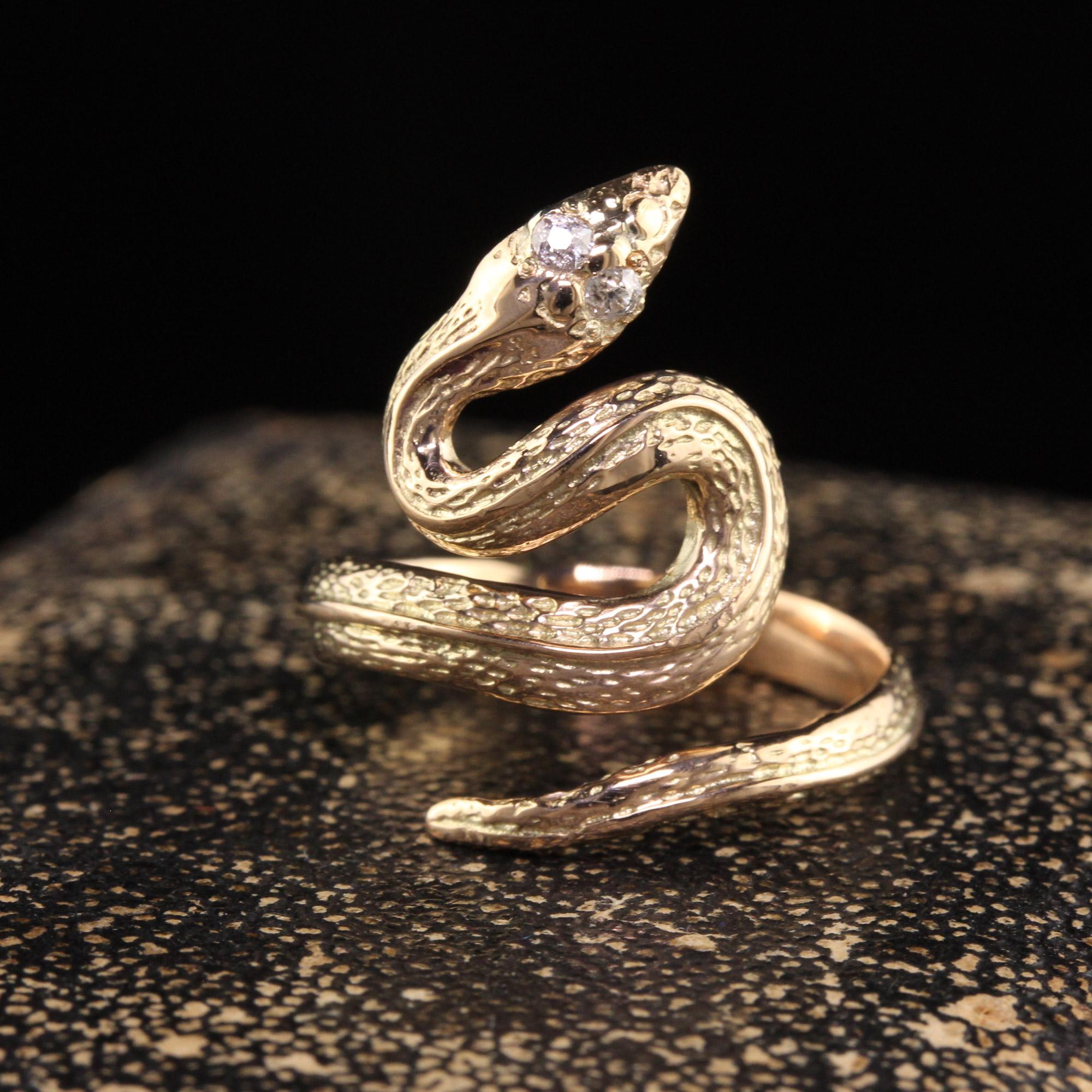 Beautiful Antique Victorian 14K Yellow Gold Old Mine Diamond Snake Wrap Ring. This beautiful ring is crafted in 14k yellow gold. The eyes on the snake are old mine cut diamonds and the entire body is covered in beautiful engravings. The ring is in