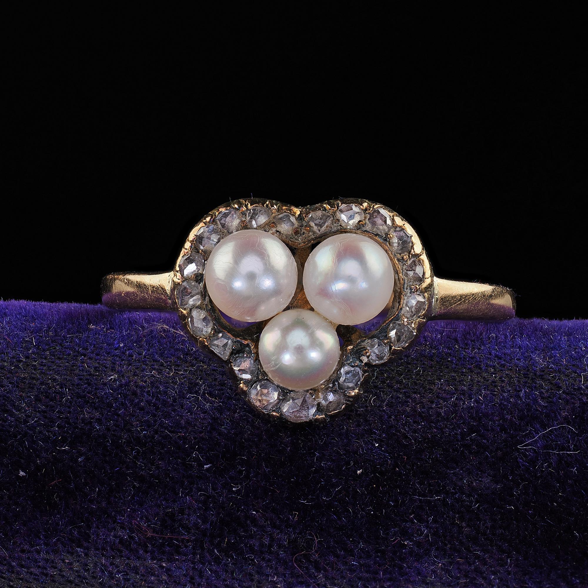 Beautiful Antique Victorian 14K Yellow Gold Pearl and Diamond Heart Clover Ring. This beautiful Victorian pearl and diamond heart clover ring is crafted in 14k yellow gold. The ring features three pearls in the center with an outer row of old cut