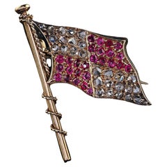 Antiguo alfiler victoriano de oro amarillo de 14 quilates con bandera de diamantes talla rosa y rubíes