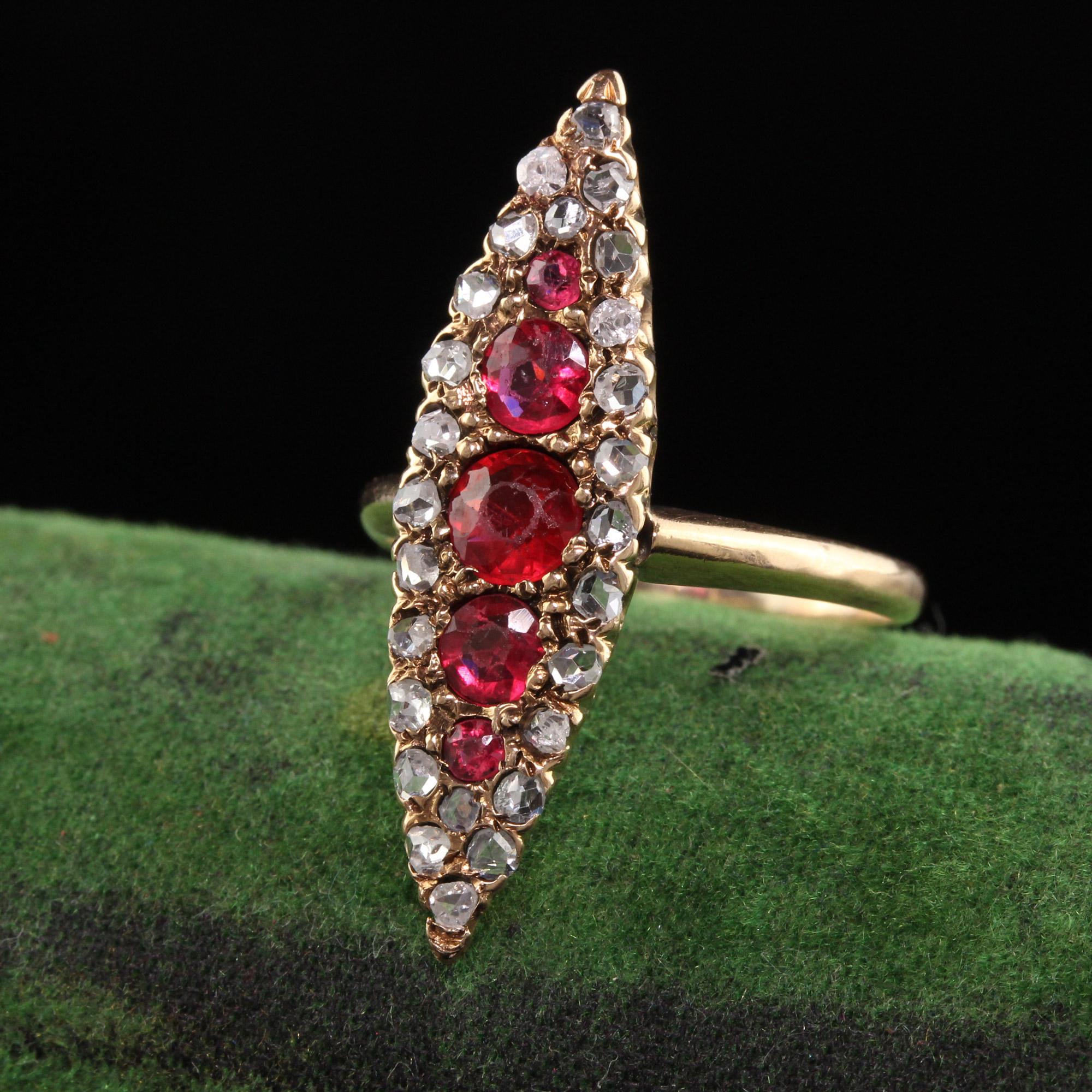 Beautiful Antique Victorian 14K Yellow Gold Ruby and Rose Cut Diamond Navette Ring. This gorgeous navette shield ring has a row of synthetic rubies in the center surrounded by rose cut diamonds set in 14K yellow gold.

Item #R1008

Metal: 14K Yellow