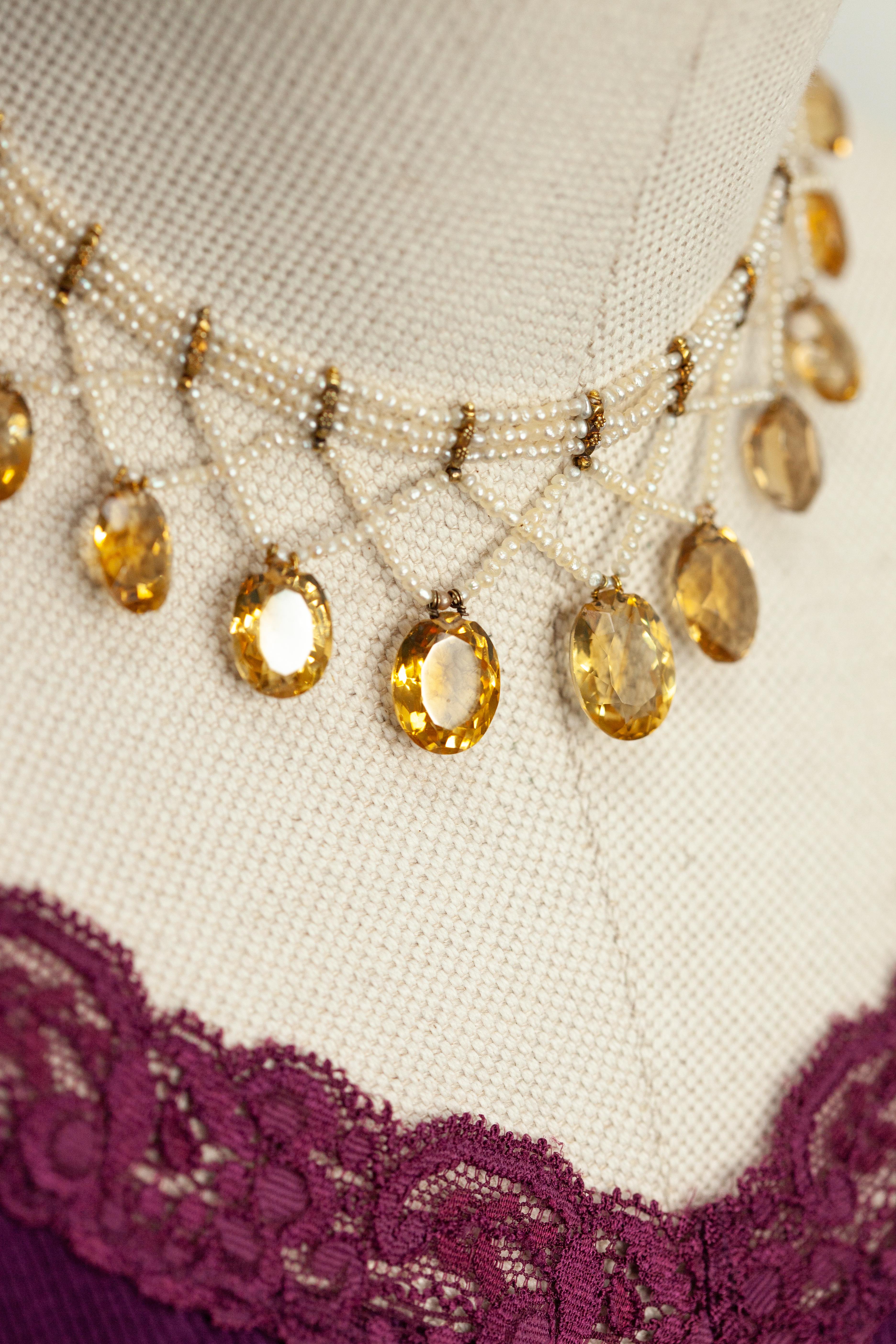 Antique Victorian 14K Yellow Gold Natural Seed Pearl citrine choker necklace with 11 oval facet cut citrines

Approximate Weight: 28.0 grams

Approximate Measurements:
Necklace Length - 13 inches
Center Front  - 38.4mm wide
Citrine - 9.02mm x