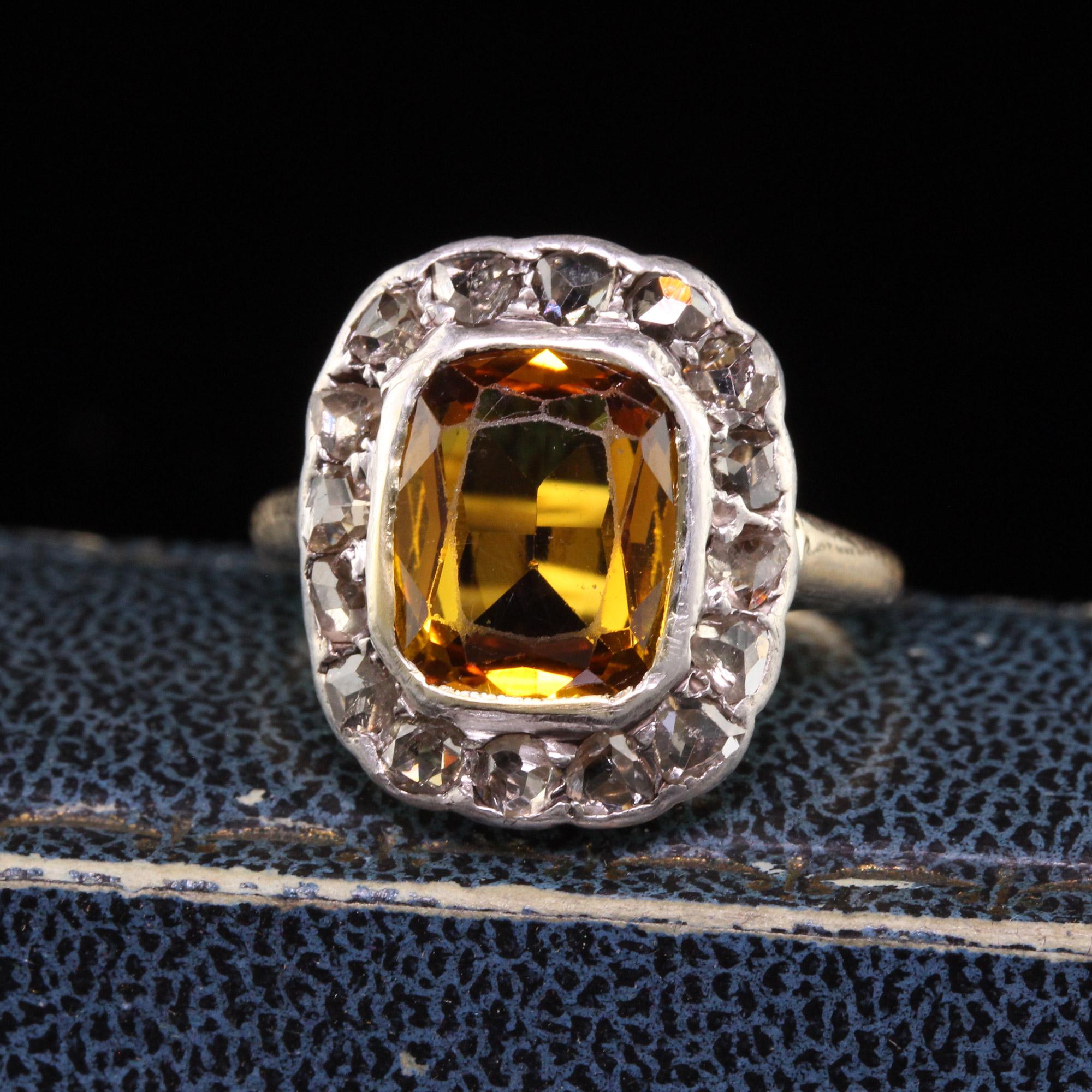 Beautiful Antique Victorian 14K Yellow Gold Silver Top Citrine Rose Cut Diamond Ring. This beautiful Victorian ring is crafted in 14k yellow gold and silver. The center holds an old cut citrine and is surrounded by rose cut diamonds set in silver