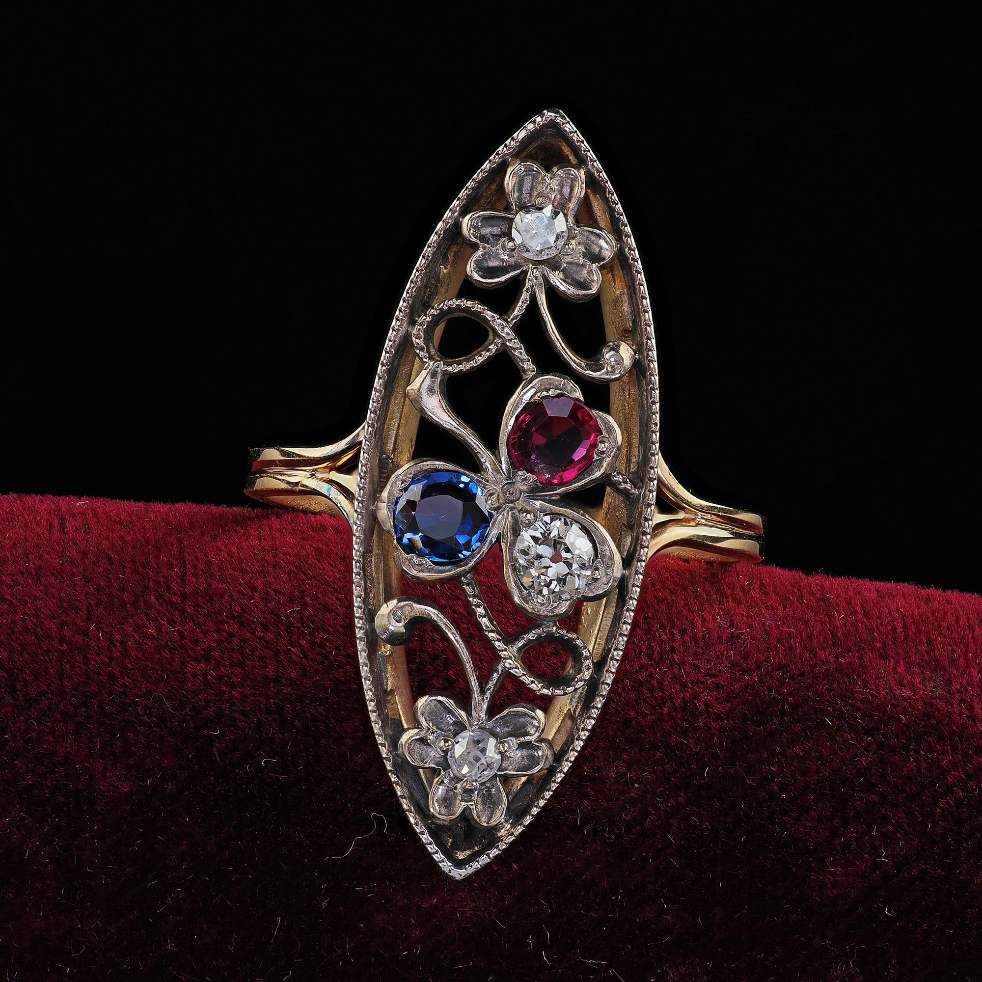 Beautiful Antique Victorian 14K Yellow Gold Silver Top Old Cut Diamond Ruby Sapphire Ring. This incredible ring is crafted in 14k yellow gold and silver top. There are old European cut diamonds set next to a natural ruby and sapphire in the clover