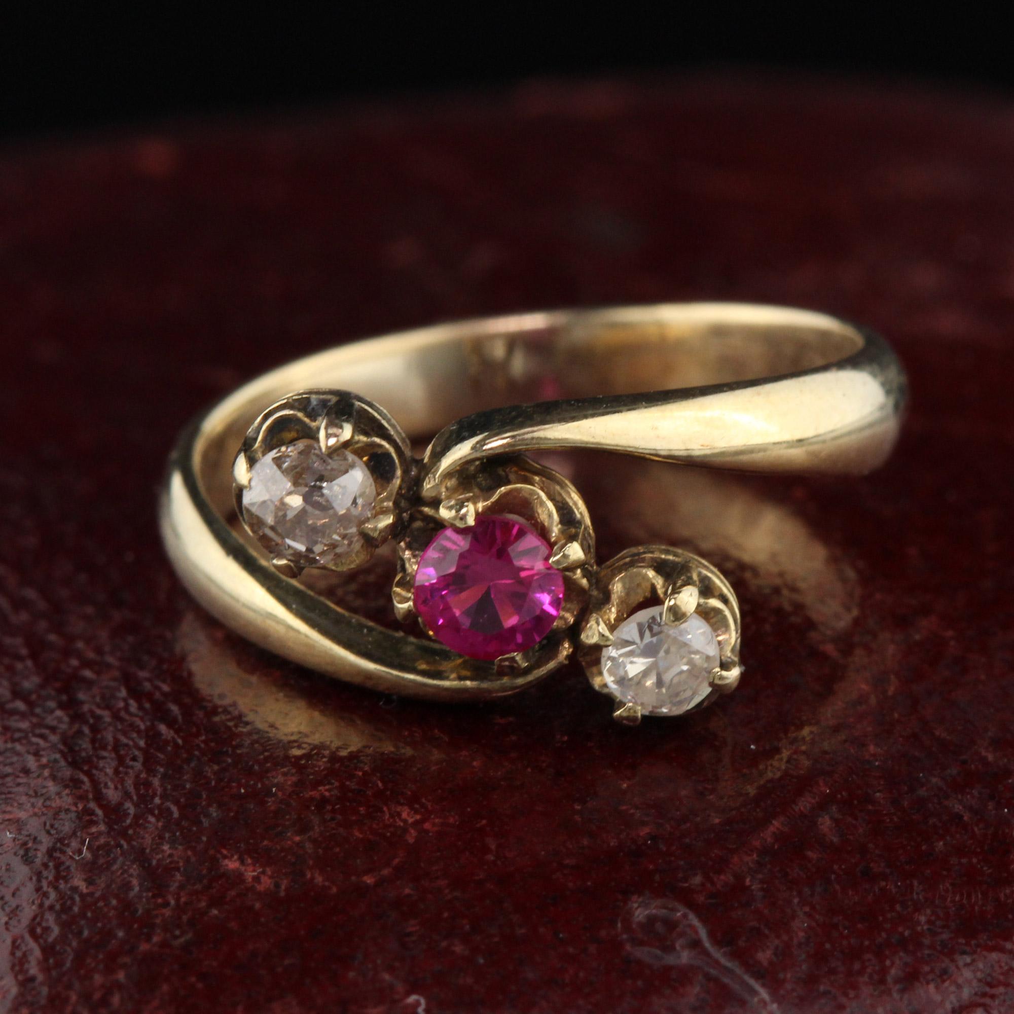 Victorian Yellow Gold three stone ring with synthetic ruby center and old cut diamonds on either side. A charming alternative engagement ring, every day ring, or pinky ring.

Metal: 14K Yellow Gold 

Weight: 2.0 Grams

Ring Size: 5

This ring can be