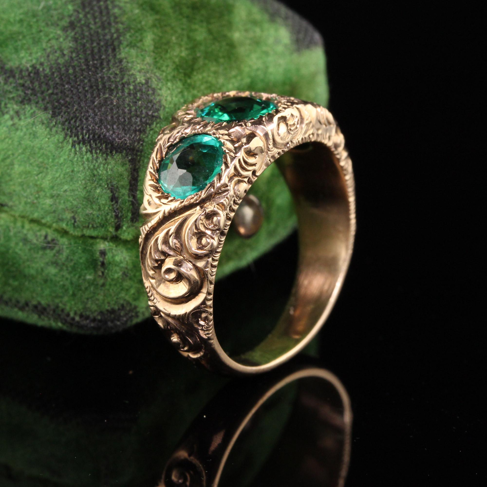 Beautiful Antique Victorian 14K Yellow Gold Three Stone Engraved Ring. This gorgeous ring has 3 green flame fusionstones in the center. The entire ring is deeply engraved and is solid all the way through.

Item #R0815

Metal: 14K Yellow