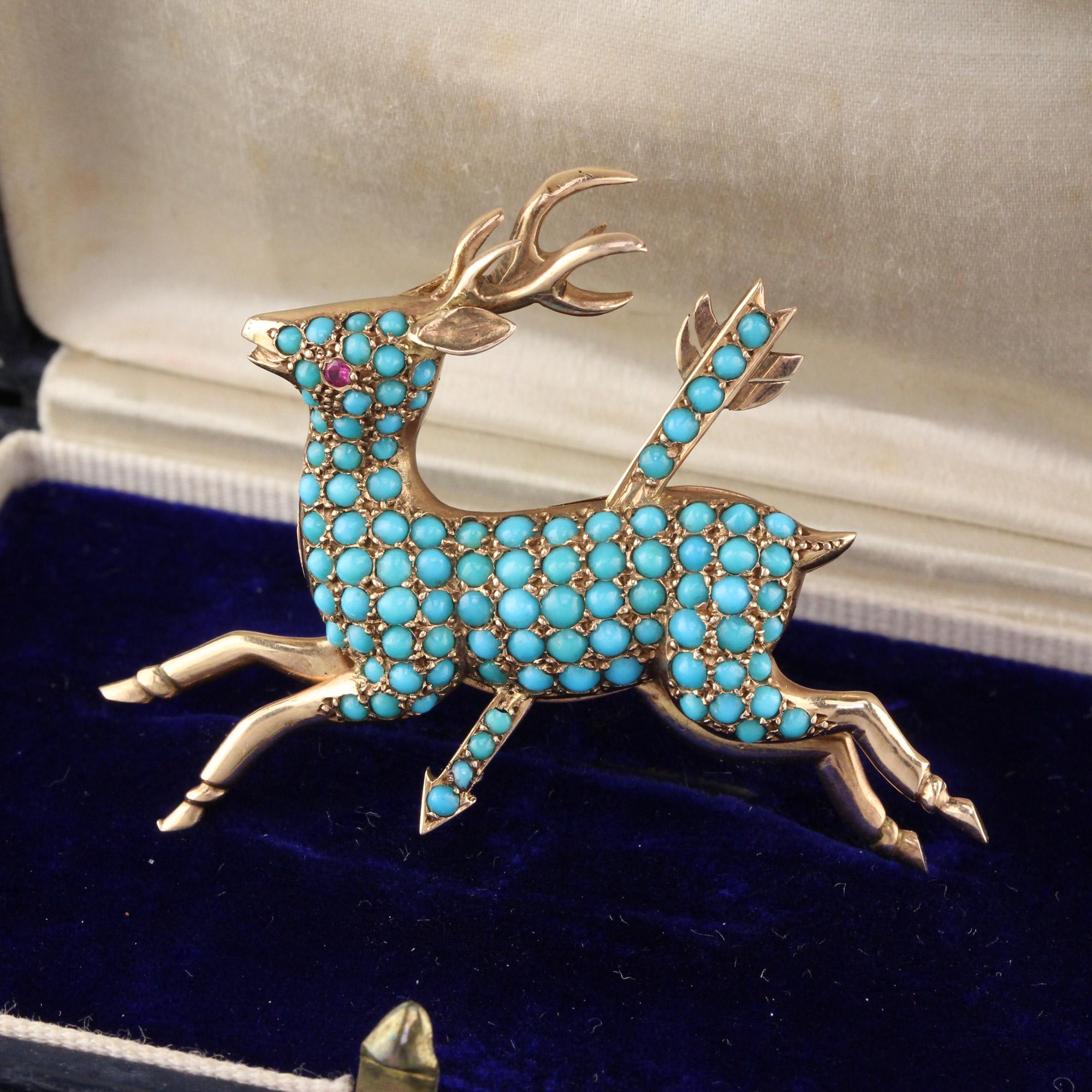 Stunning antique victorian deer brooch with an arrow going through it in yellow gold with small cabochon turquoises and a ruby eye.

Metal: 14K Yellow Gold 

Weight: 13.5 Grams 

Measurements: 36.3 x 50.8 mm