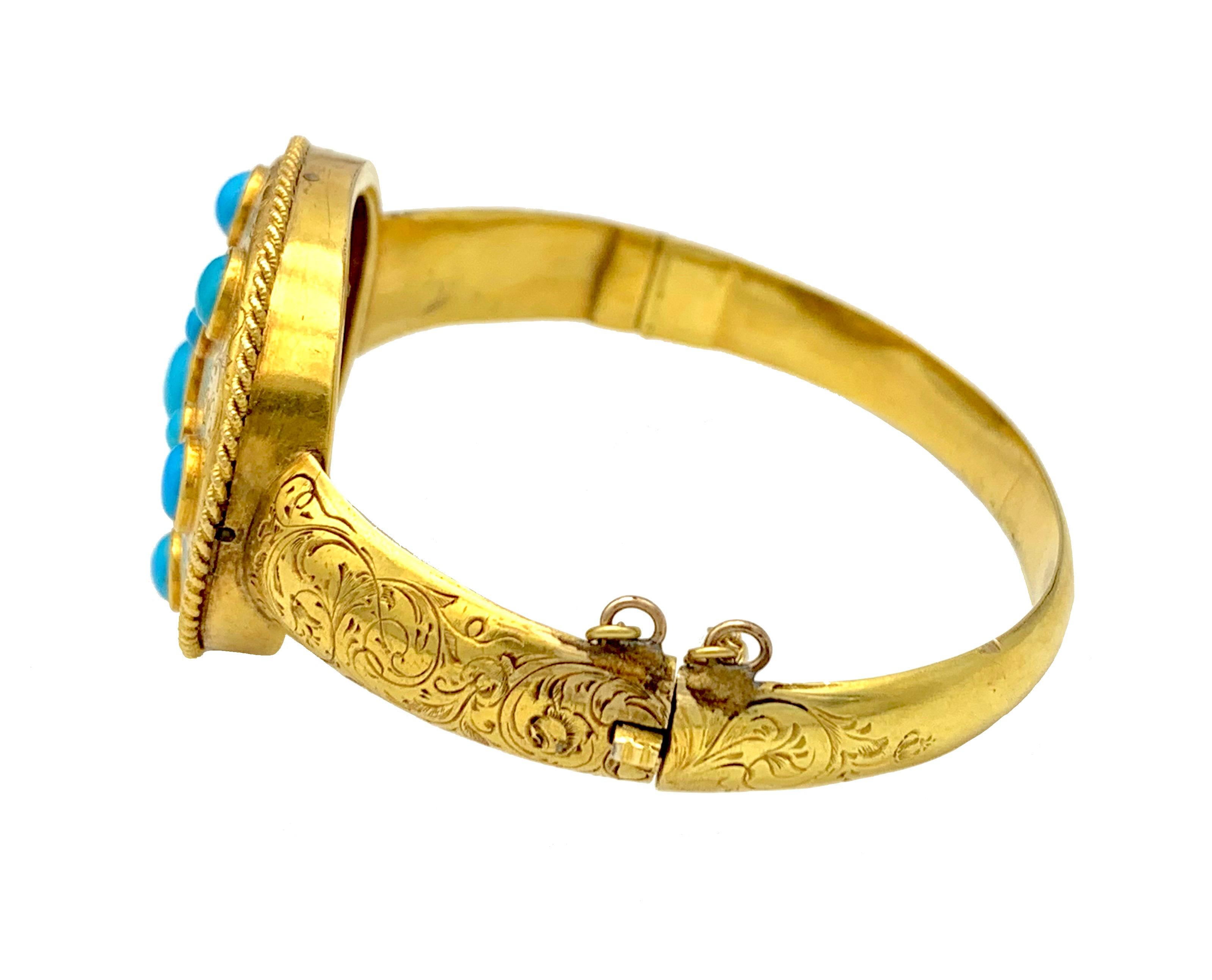 This exquisite gold bangle features as a star made out of fine turquoise cabochon within an oval surround framed by twisted gold wire. The bangle is decorated with fine hand engraving. The jewel was made in 1845 ca and has survived nearly 180 years