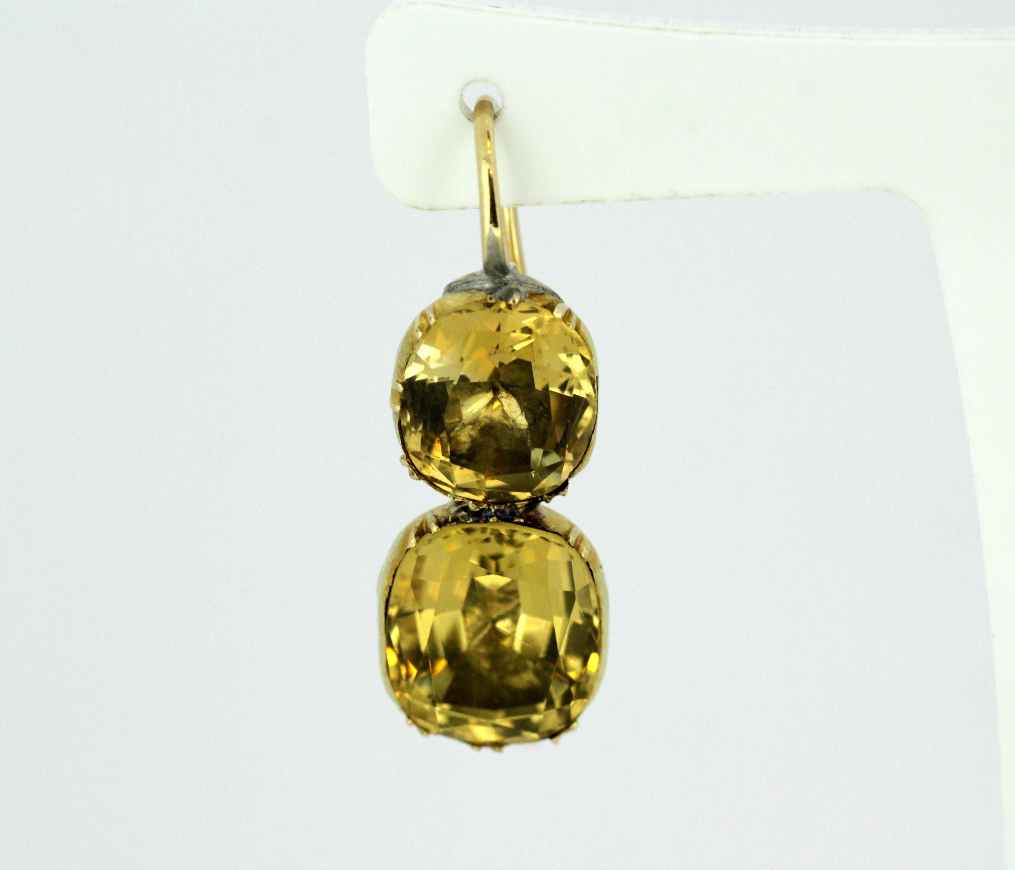 Antique Victorian 15kt gold earrings with natural citrine.
Made in England Circa 1850's
Tested positive for 15kt gold.

Approx Dimensions - 
Size : 3.4 x 1.3 x 1.7 cm
Weight : 10 grams

Citrine - 
Cut : Cushion
Quantity : 4
Sizes : 5 ct & 3