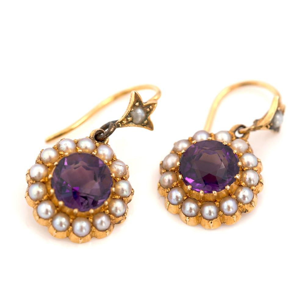 Our unique antique 15ct gold Victorian drop earrings feature a star motif, with bright round faceted amethyst gemstones with stunning natural split pearl halo. Expertly handmade and these authentic one-of-a-kind earrings provide a timeless and