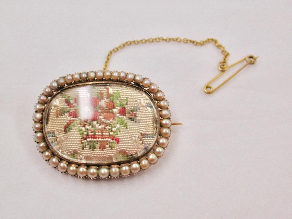 Antique Victorian 15ct Gold and Seed Pearl Brooch,Dated Circa 1850's
This beautiful brooch is in good order with all the original half pearls,and has
a miniature tapestry basket of flowers in the centre.
I should imagine this brooch was amongst the