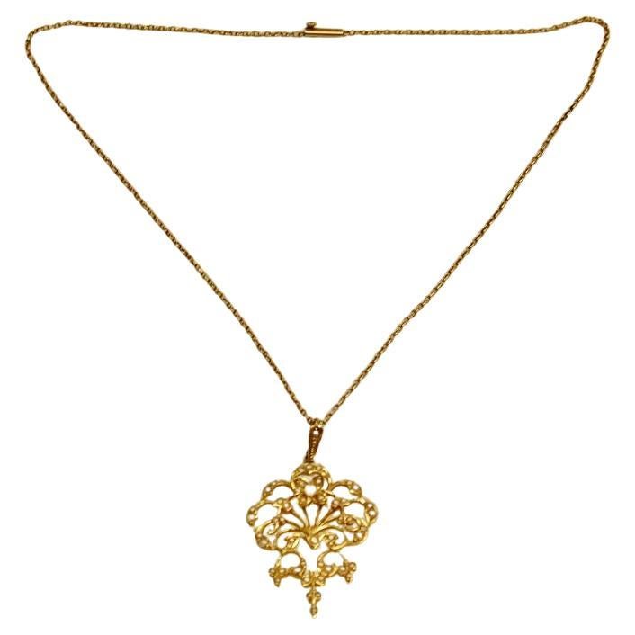 Antique Victorian 15ct Gold & Seed Pearl Pendant on 15ct Chain Dated Circa 1900.
This beautiful pendant  with original chain and barrel snap has  15ct stamps on each.
