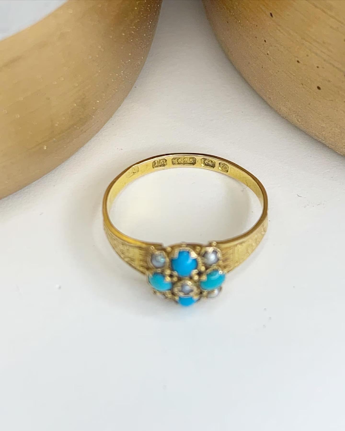 Turquoise & Pearl Ring 

15ct Gold 

Victorian- Hallmarked Birmingham 1899
Fabulous Hand Engraved Shoulders. 

UK Size K 

US Size 5 1/2

Can be resized using our resizing service,
please contact us for more information

All of our items are either