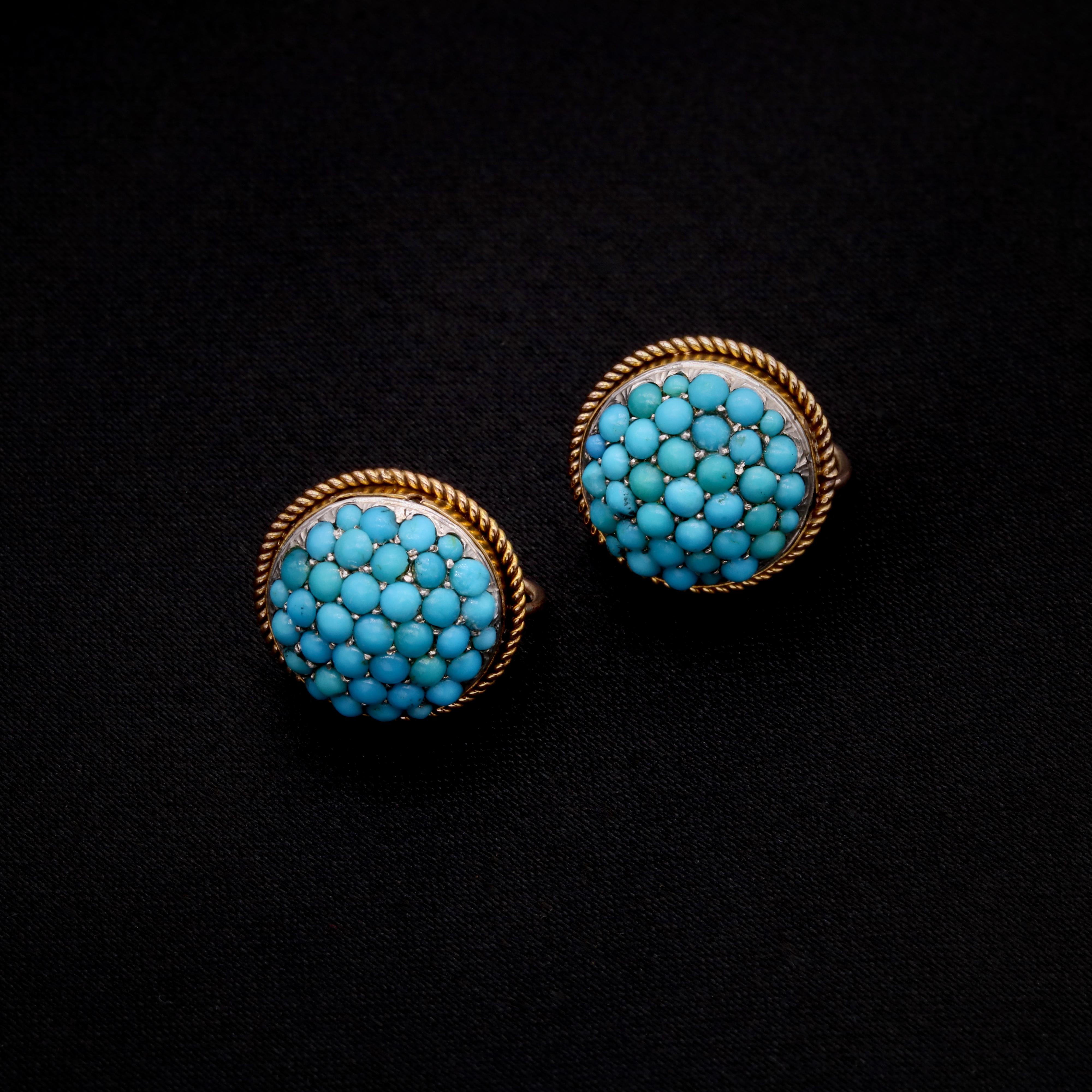 A pair of Victorian turquoise, and yellow gold earrings, each comprising thirty-seven round cabochon turquoise stones, in 15 karat yellow gold and silver. 

My favourite thing about these Victorian 15K Yellow Gold Turquoise Earrings is the vibrant