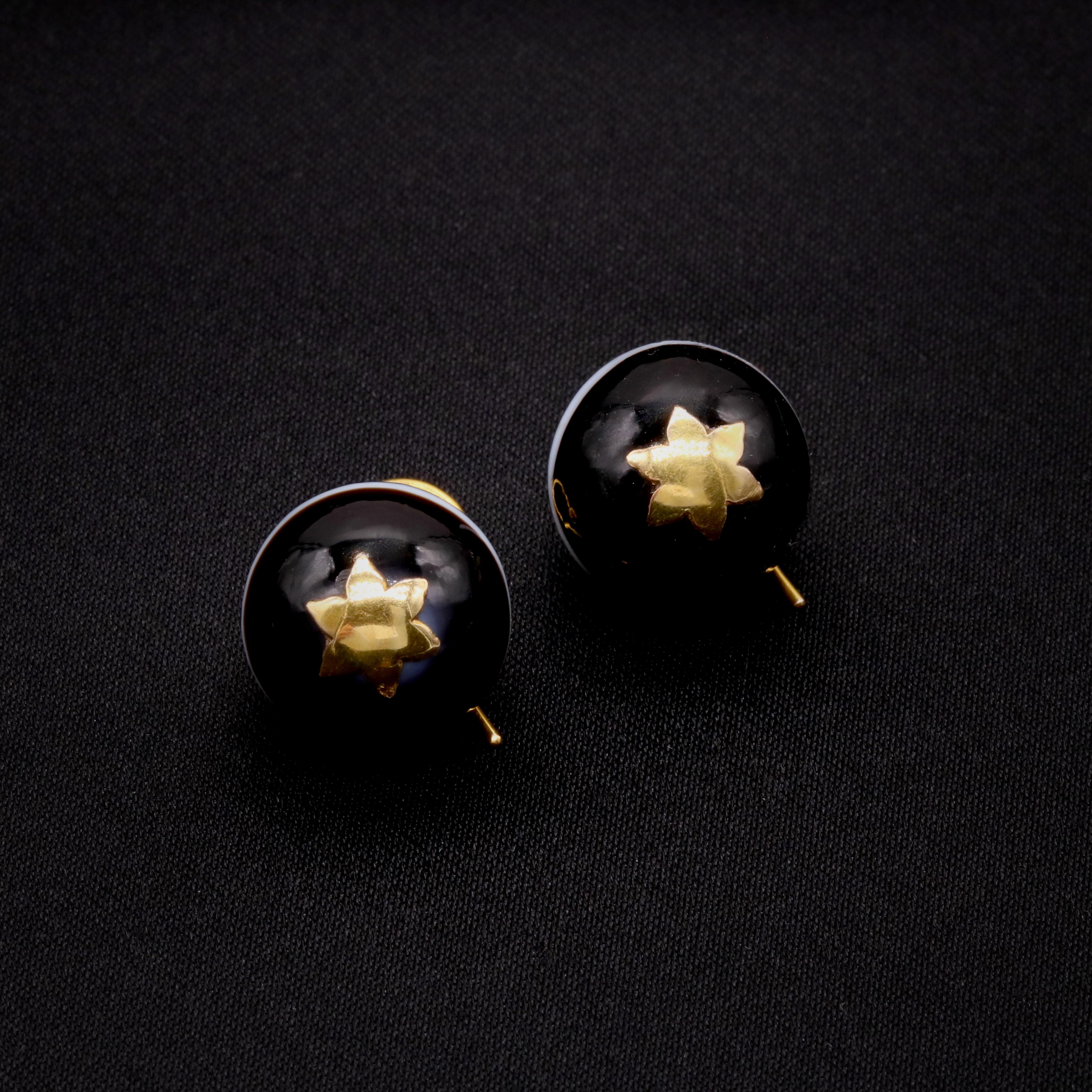 A pair of Victorian yellow gold, and banded agate earrings, each comprising two spheres of banded agate, in 15 karat yellow gold. 

My favourite thing about these Antique 15K Gold Agate Earrings is the statement striped spheres. What’s yours?