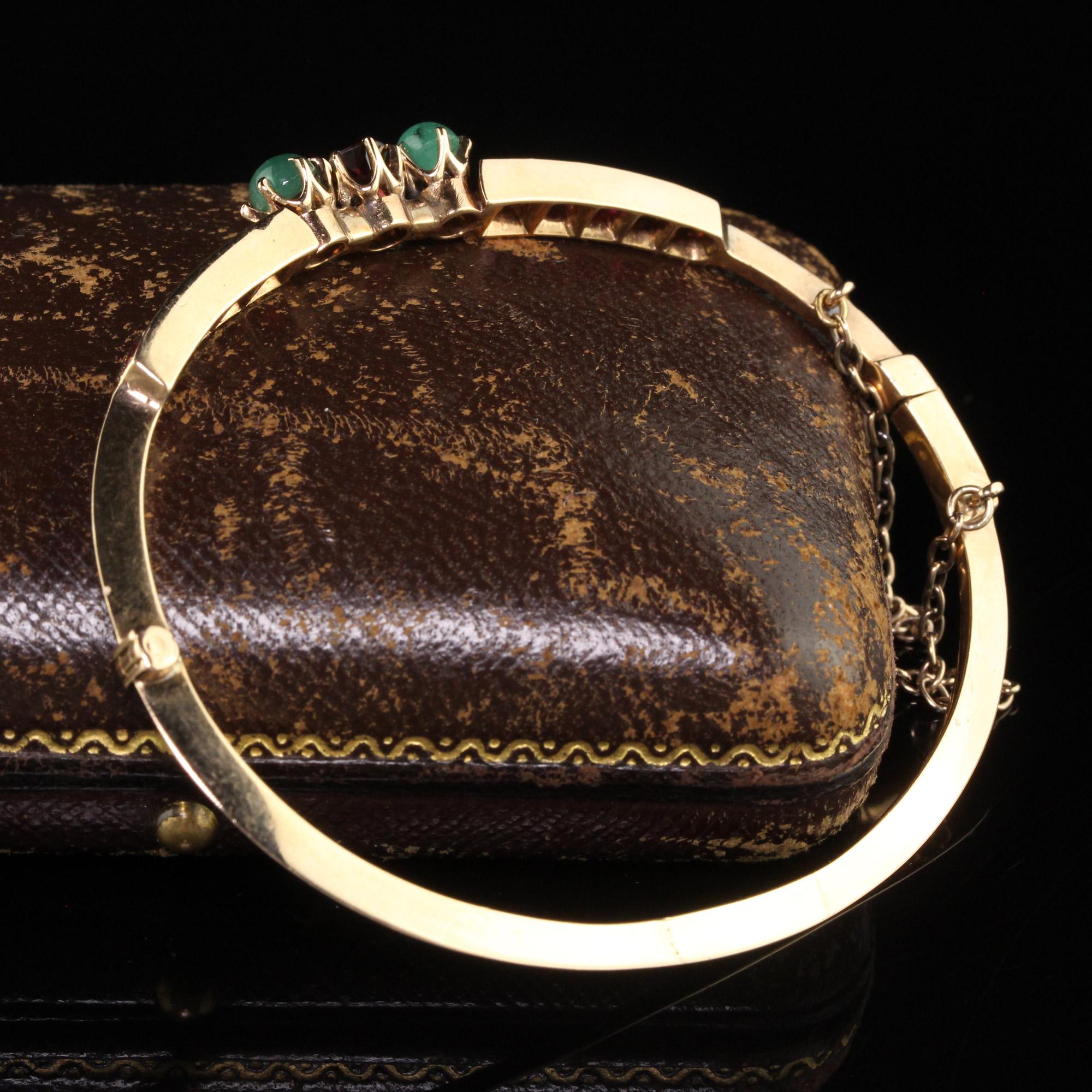 Cabochon Antique Victorian 15K Yellow Gold Garnet and Emerald Bangle Bracelet