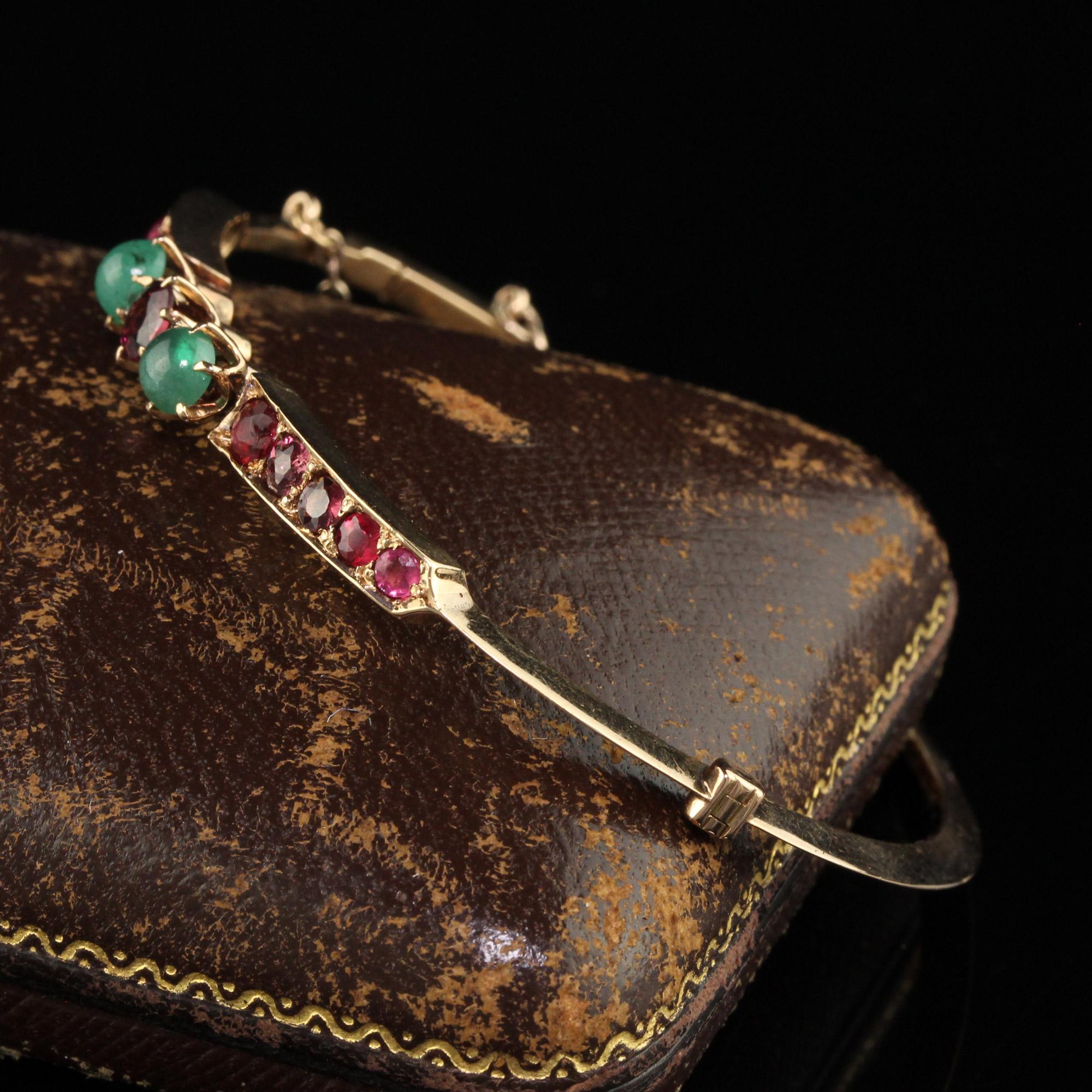 Antique Victorian 15K Yellow Gold Garnet and Emerald Bangle Bracelet In Good Condition In Great Neck, NY