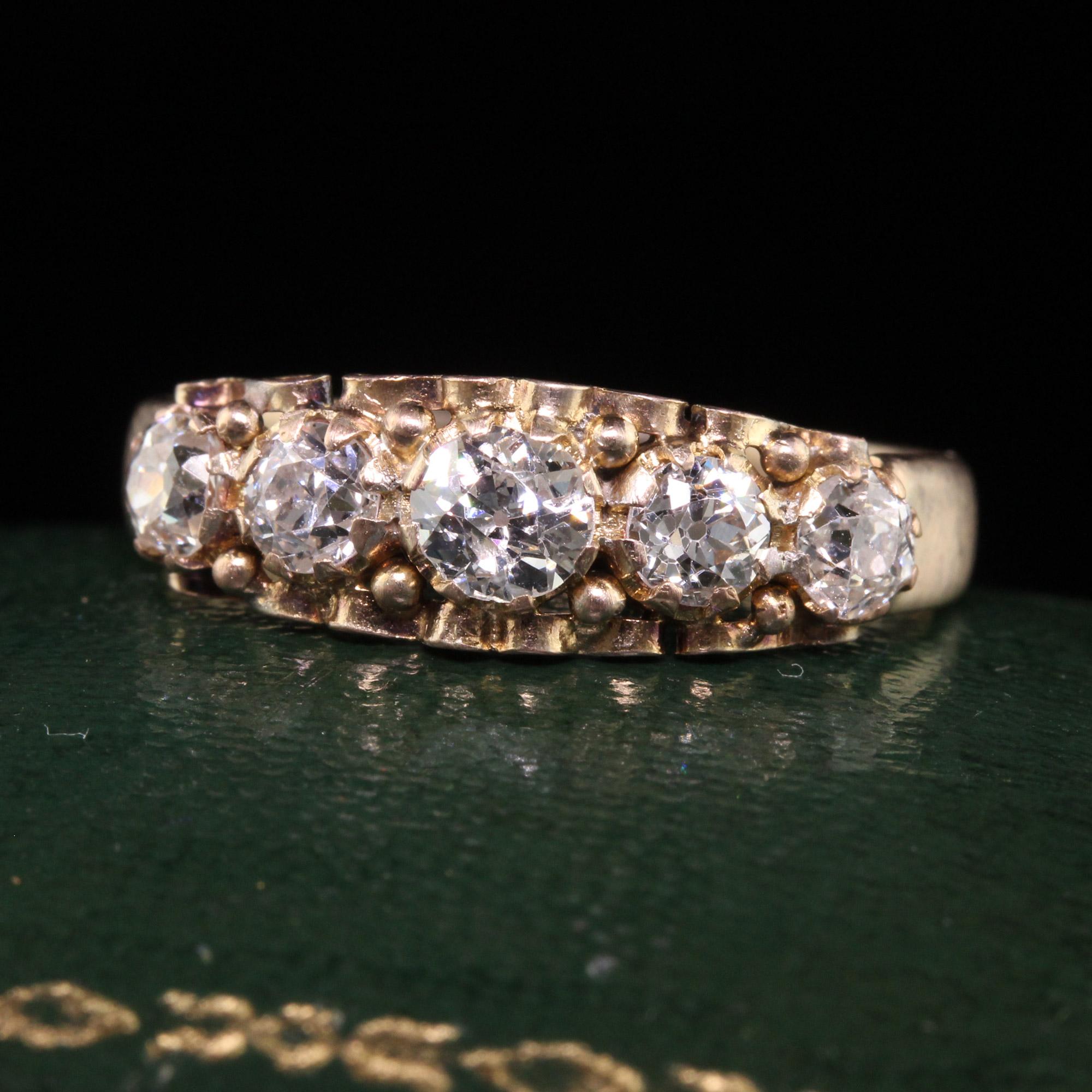 Beautiful Antique Victorian 15K Yellow Gold Old European Cut Diamond Five Stone Band. This beautiful band is crafted in 15k yellow gold. The ring features five old european cut diamonds set in a gorgeous Victorian 15k mounting. It has a low profile