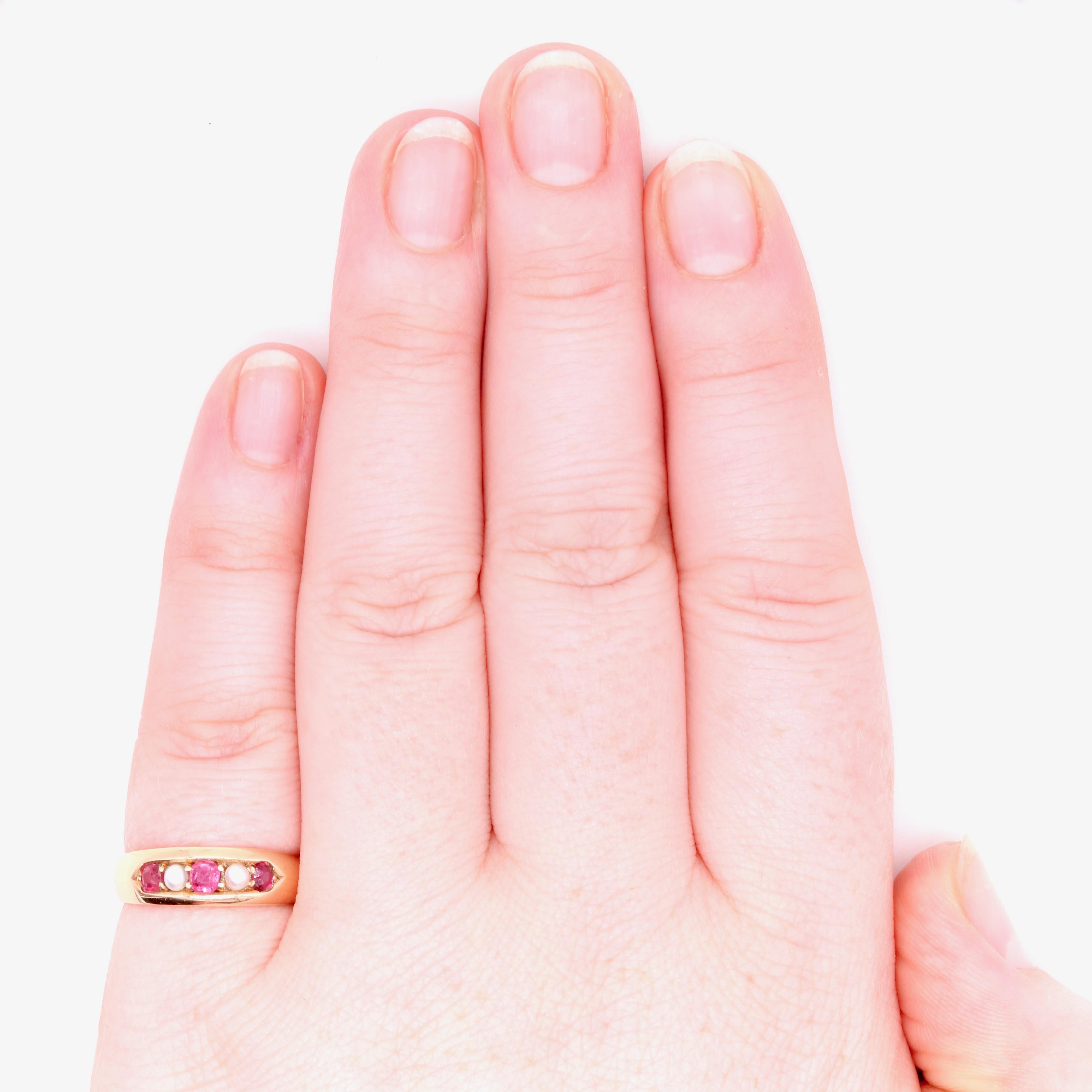 A Victorian ruby, pearl, and yellow gold ring, comprising three cushion shaped rubies, and two half pearls, in 15 karat yellow gold. 

My favourite thing about this Victorian 15K Gold Ruby and Pearl Ring, is the soft hue of the rubies. What’s yours?