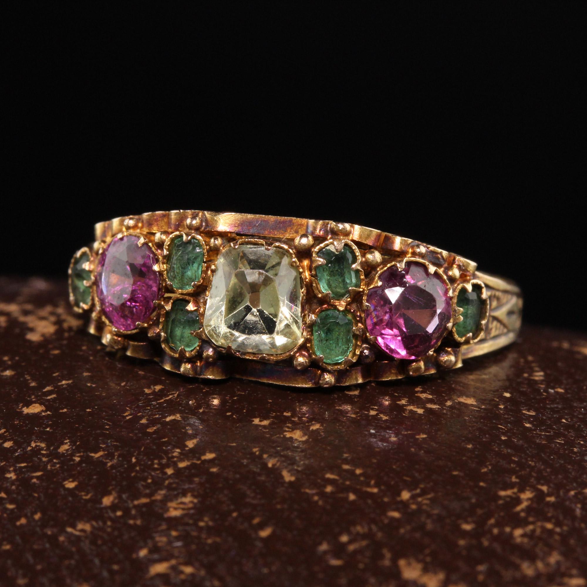 Beautiful Antique Victorian 15K Yellow Gold Ruby Emerald and Chrysoberyl Engraved Ring. This amazing Victorian ring has rubies, emeralds and a cushion chrysoberyl in the center on a pristine filigree engraved victorian mounting. The ring is in