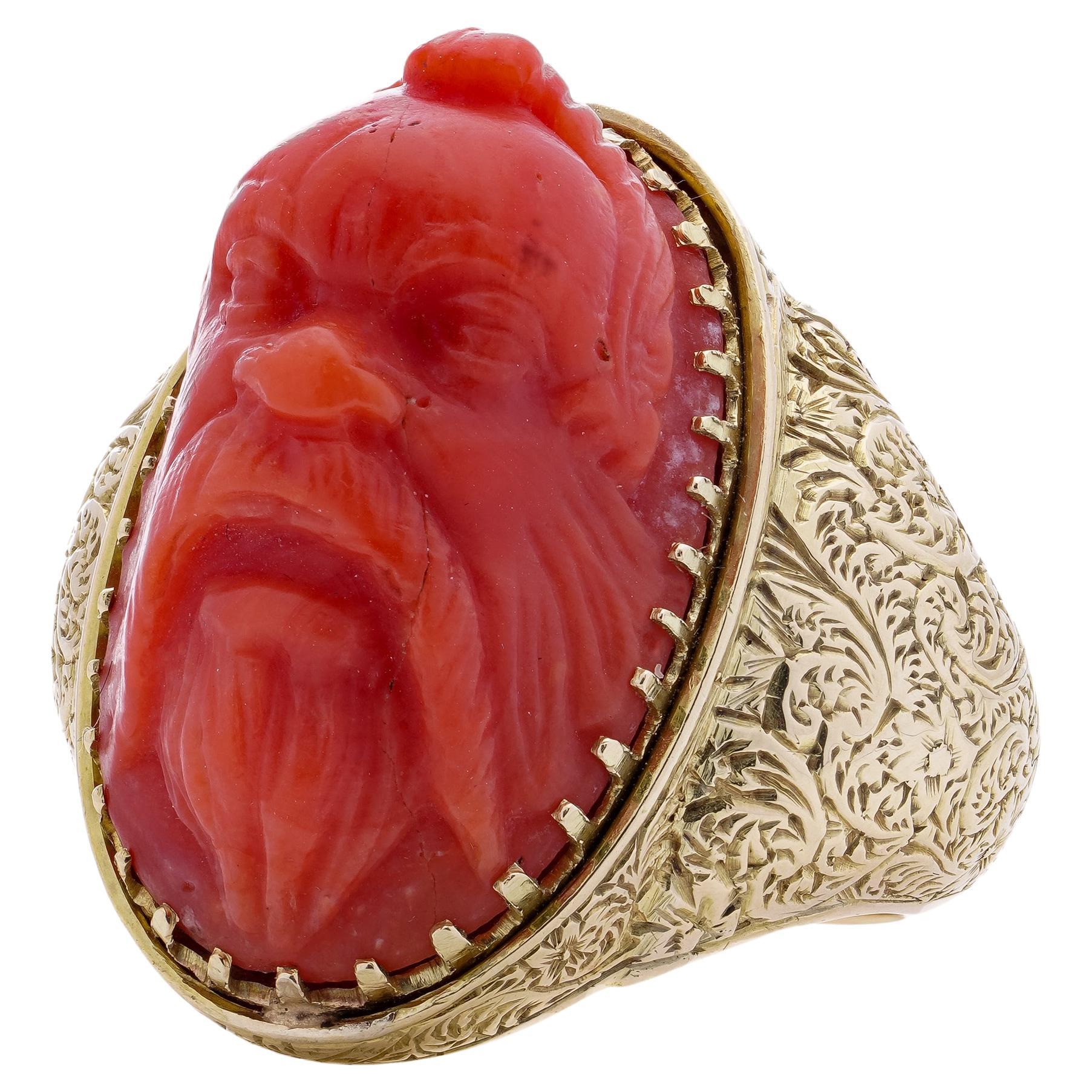 Antique Victorian 15kt. yellow gold coral ring, featuring a carved river God For Sale