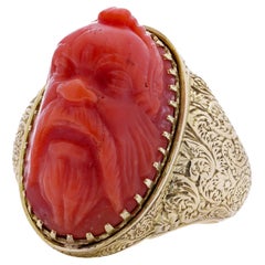 Antique Victorian 15kt. yellow gold coral ring, featuring a carved river God
