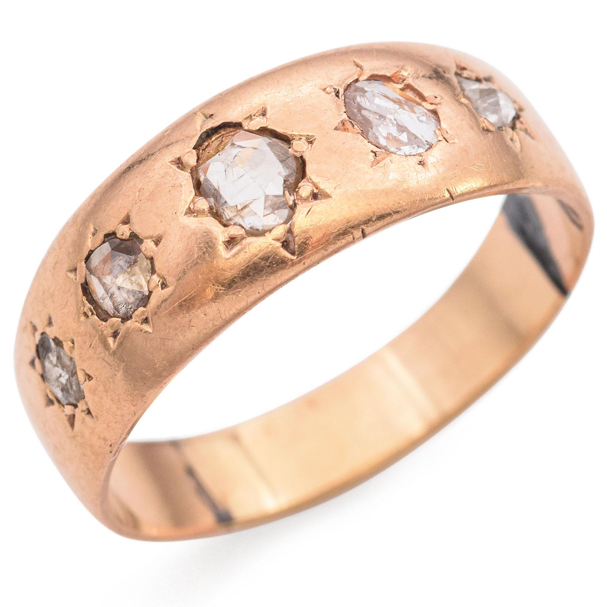 This refined ring features a warm rose gold band with five rose cut white diamonds, graduating from the center stone. Set in a classic Victorian design, the soft, glowing light from the rose cuts is beautifully highlighted by the warm rose gold,