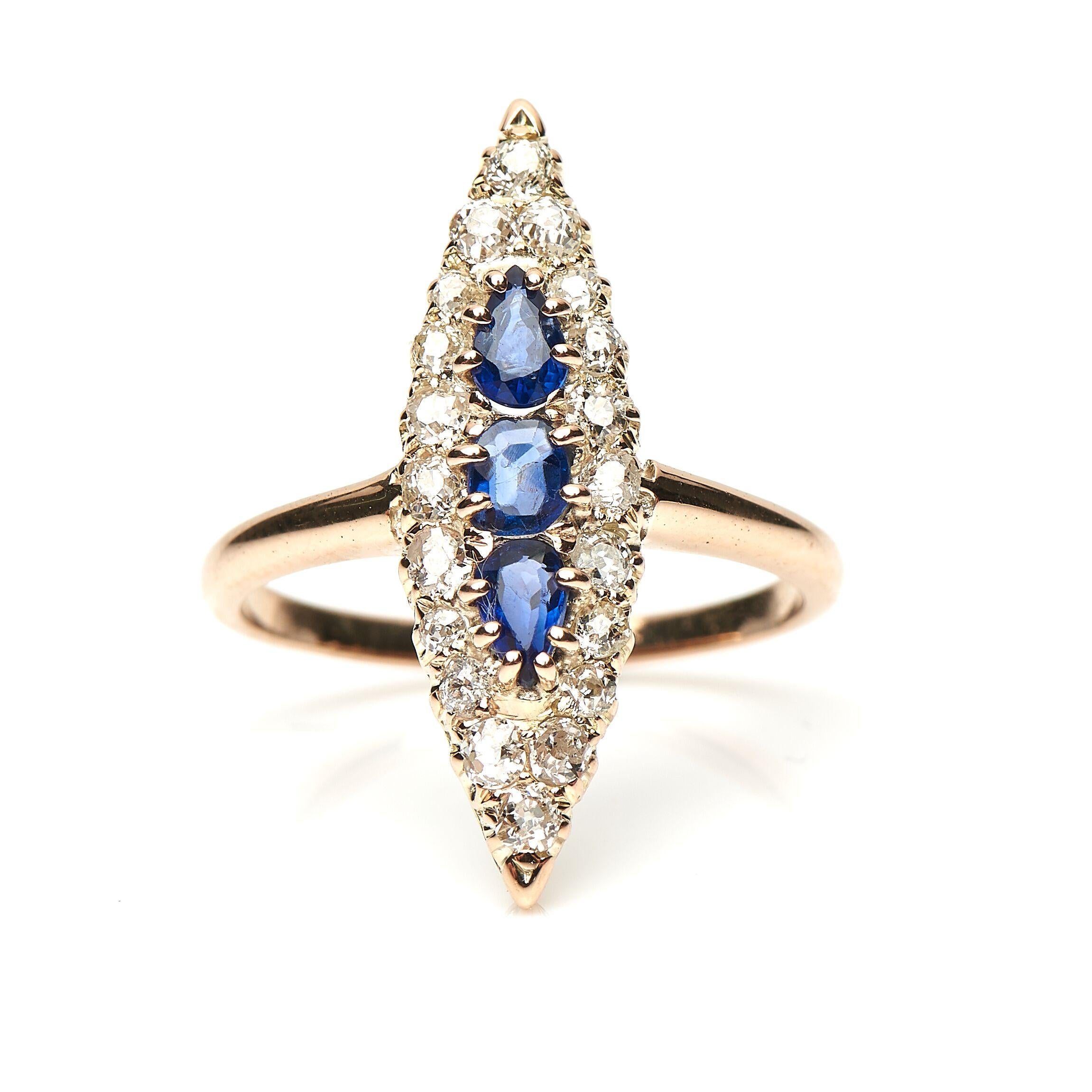 Victorian, sapphire and diamond navette shape ring, circa 1890. Set to centre an oval sapphire with two further vertically set pear-cut sapphires with a boarder of old cut diamonds. The sapphires are a wonderful mid-blue hue and the diamonds are