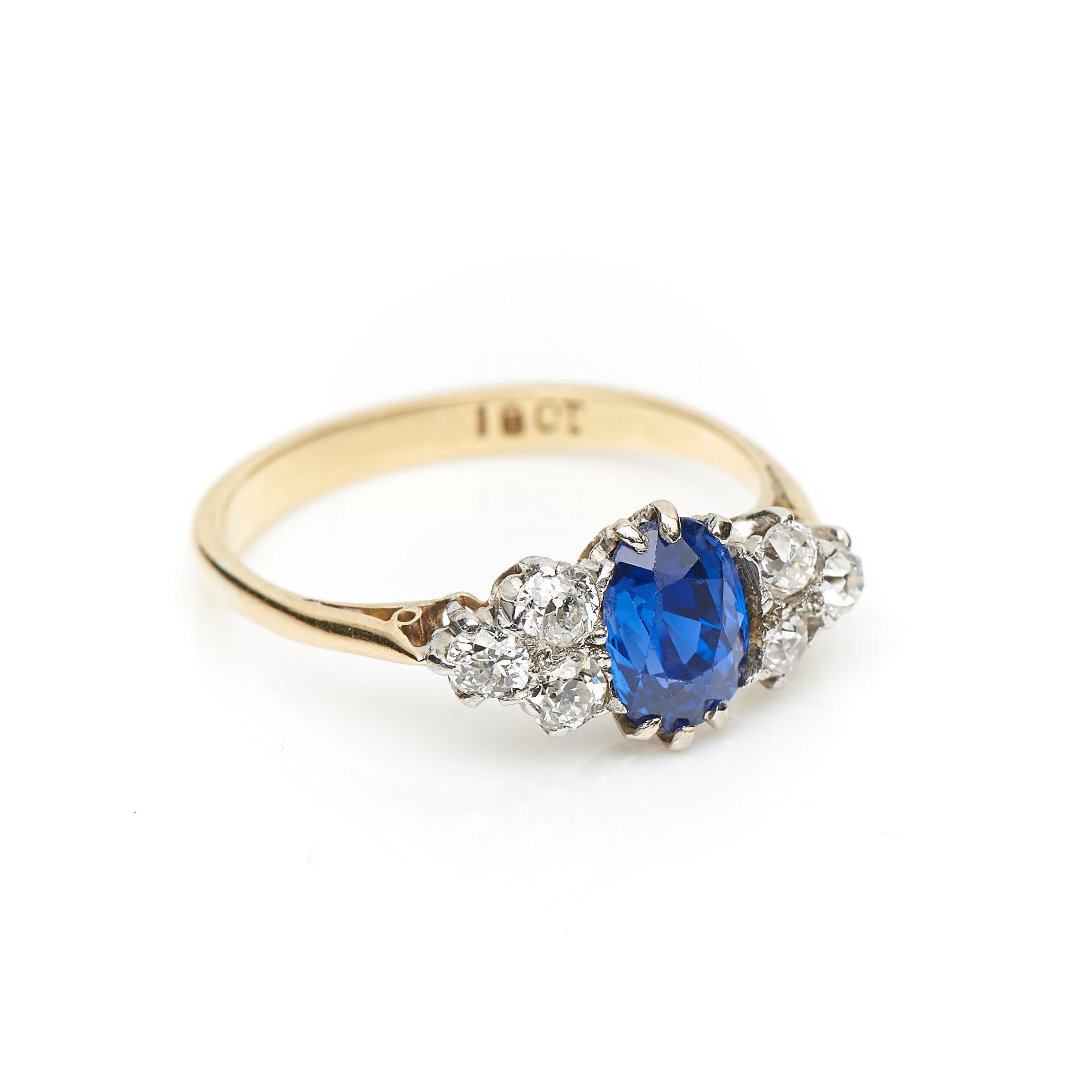 Victorian, sapphire and diamond ring, circa 1880. Set to centre an oval sapphire displaying an electric play of blue tones with a cluster of old cut diamonds on each shoulder. This is simply a beautiful sapphire; it’s depth of colour makes it a