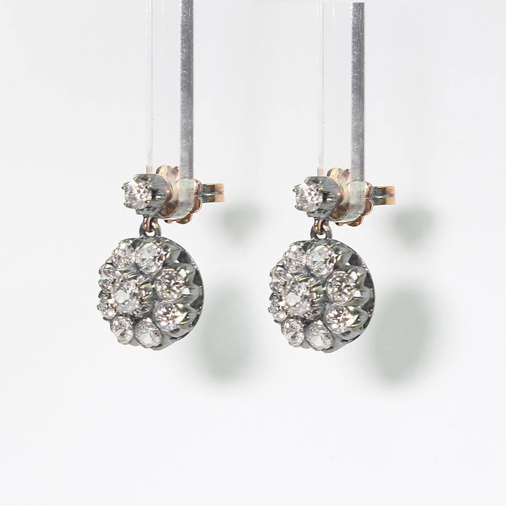 Period: Victorian (1836-1901)
Composition: 18K Gold and silver.

Stones:
•	2 Old mine cut diamonds of H-SI1 quality that weigh 0.70ctw. (0.35ct. each).
•	18 Old mine cut diamonds of H-SI1 quality that weigh 2.40ctw. 
Earring measures: 20mm by 12mm