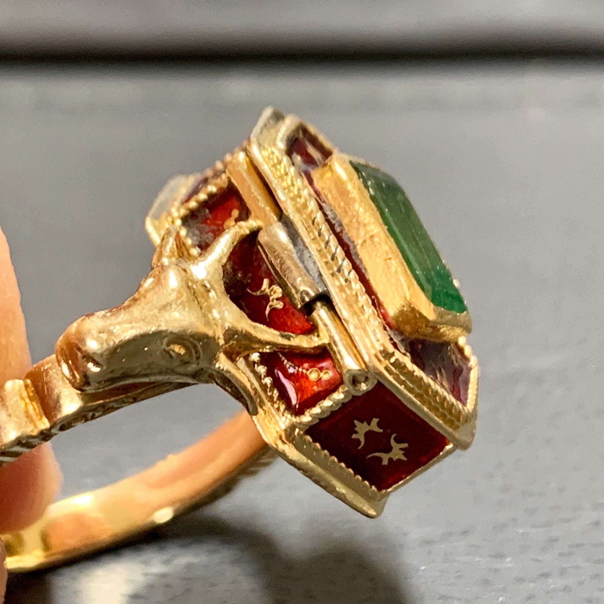 Antique Victorian 18 Karat Gold, Emerald and Enamel Snuff, Poison, locket Ring.

Extremely rare lover piece.

Age-related condition.

Hallmarked.
Inner diameter: 19mm.
US Ring Size: 9.1 (9)